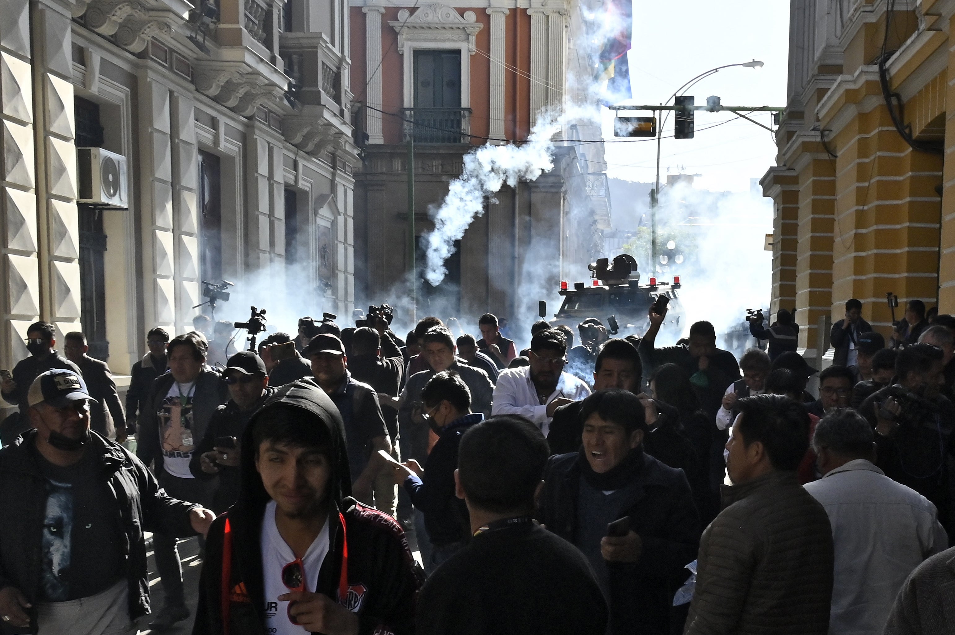 Military troops fire tear gas at people outside the Quemado Palace at Plaza Murillo in La Paz on June 26, 2024