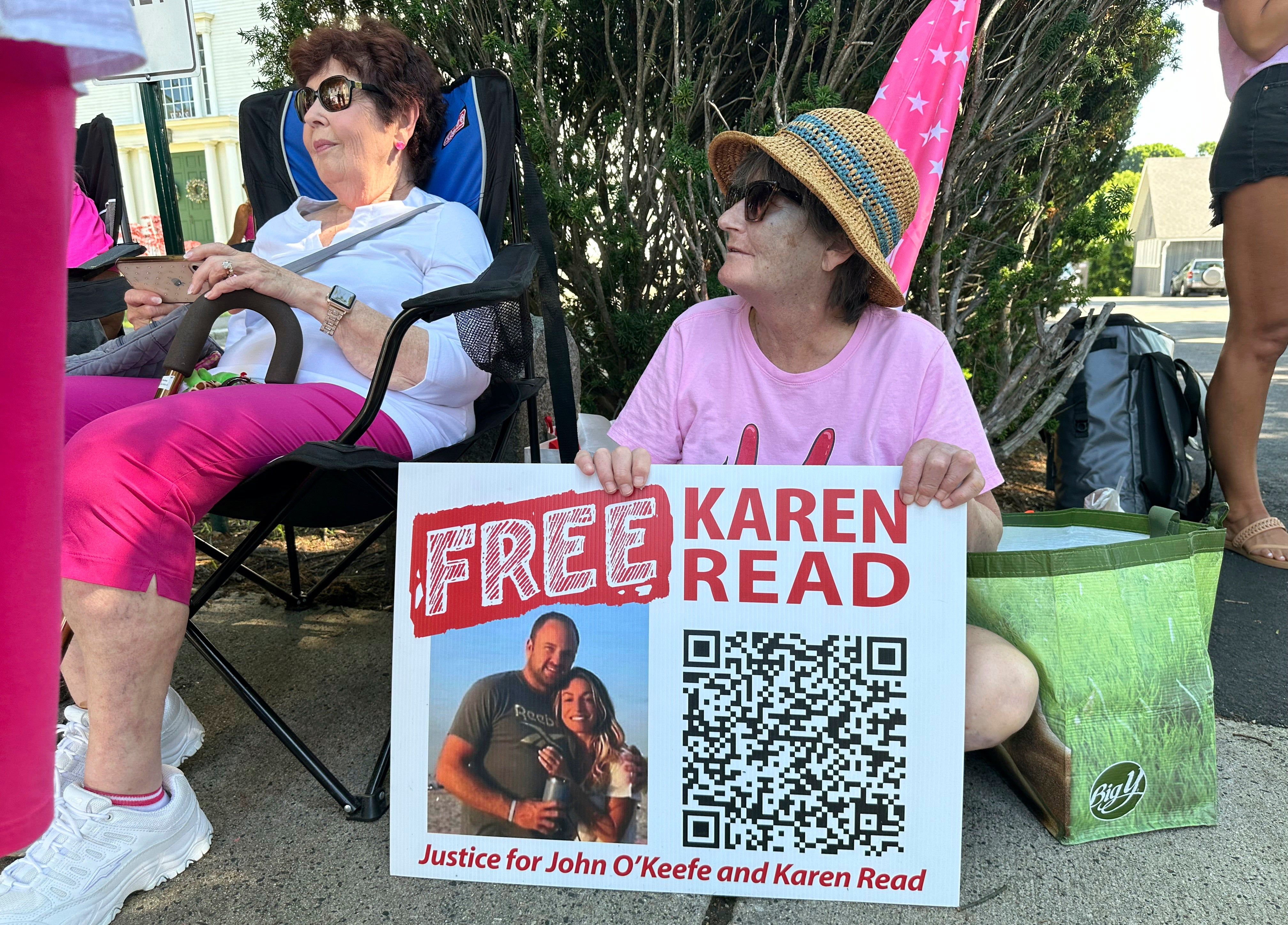 Supporters of Karen Read display signs near Norfolk Superior Court, Tuesday, June 25, 2024, in Dedham, Mass