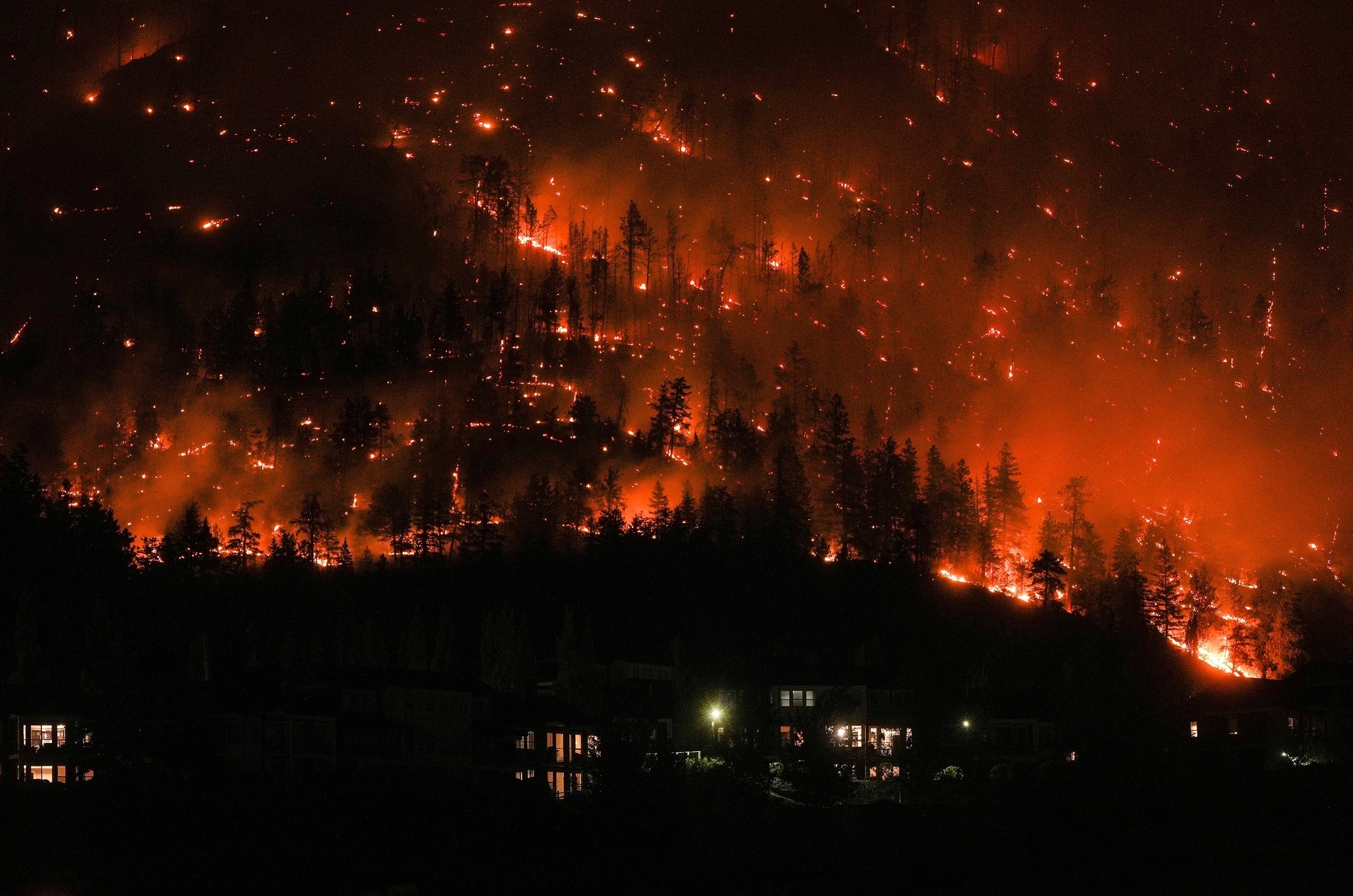 The August 2023 McDougall Creek wildfire burns in West Kelowna, British Columbia. The wildfires spread over more than 45 million acres, reaching from British Columbia to Quebec.