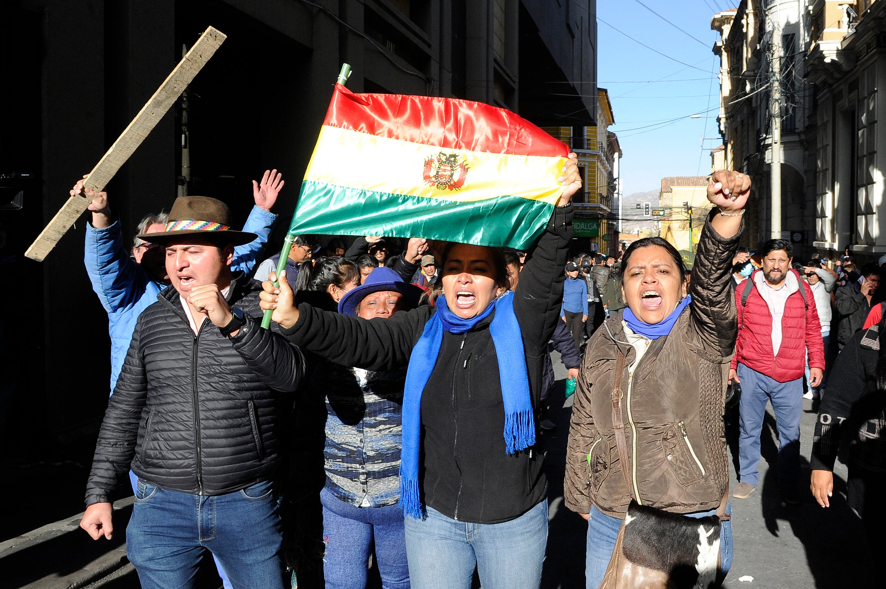 Supporters of Bolivian President Luis Arce shout slogans at Plaza Murillo in La Paz