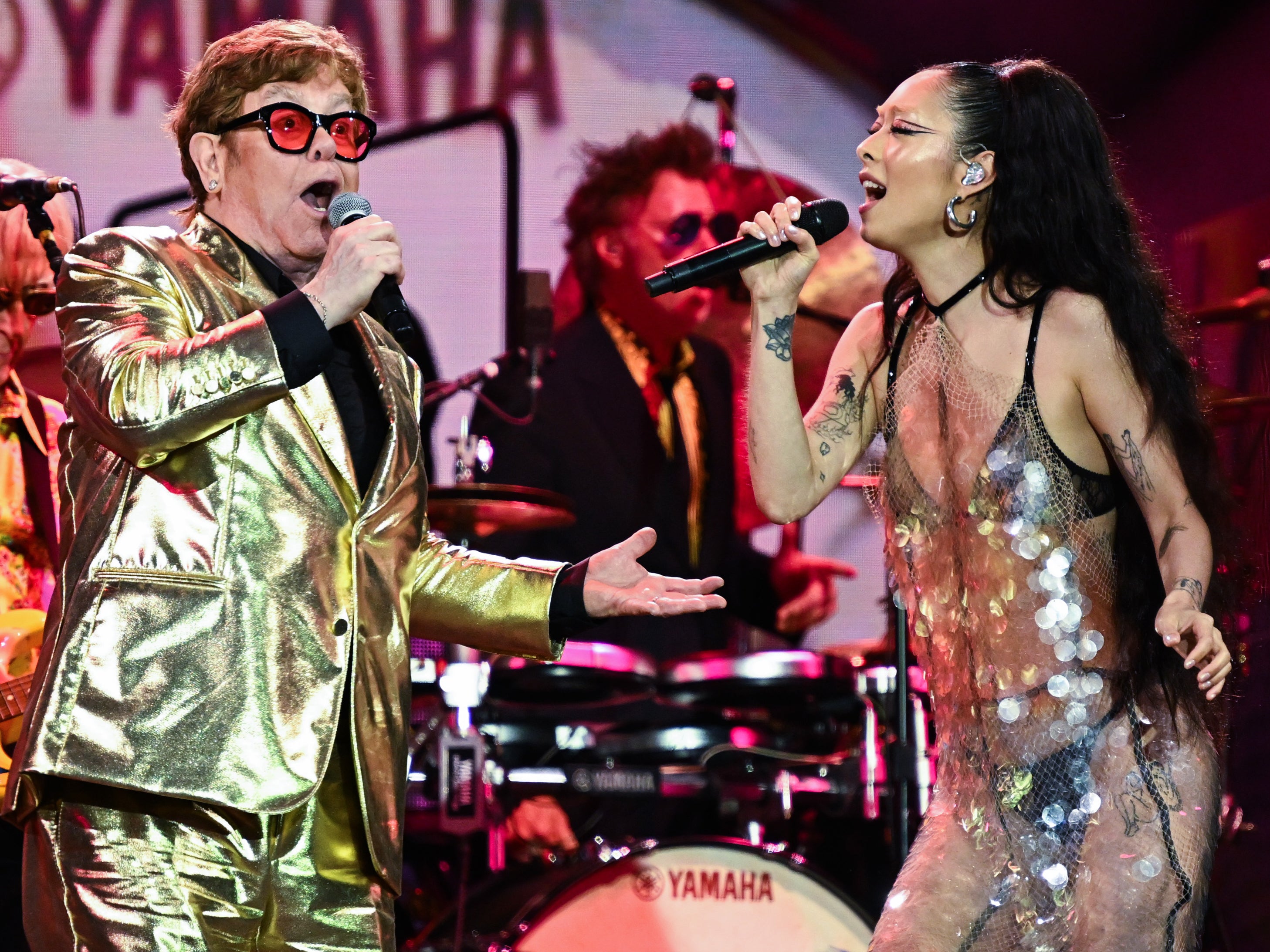 Elton John and Rina Sawayama perform on stage