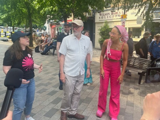 Corbyn prepares to dance alongside a young environmental activist on the campaign trail