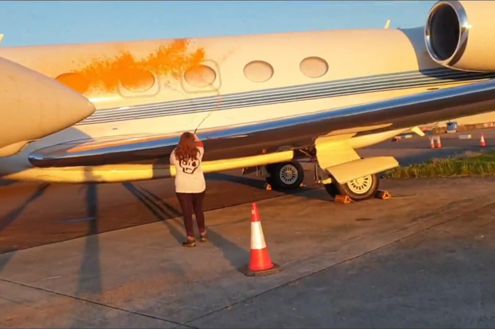 Just Stop Oil protesters spraying orange paint on parked private jets at Stansted (Just Stop Oil/PA)