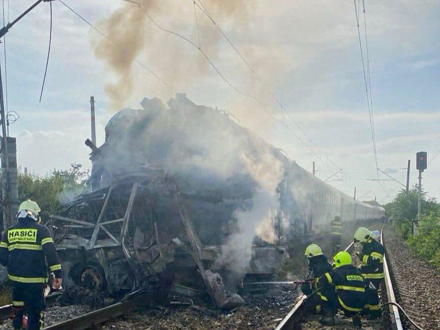 A handout image shows firefighters at the site of the accident