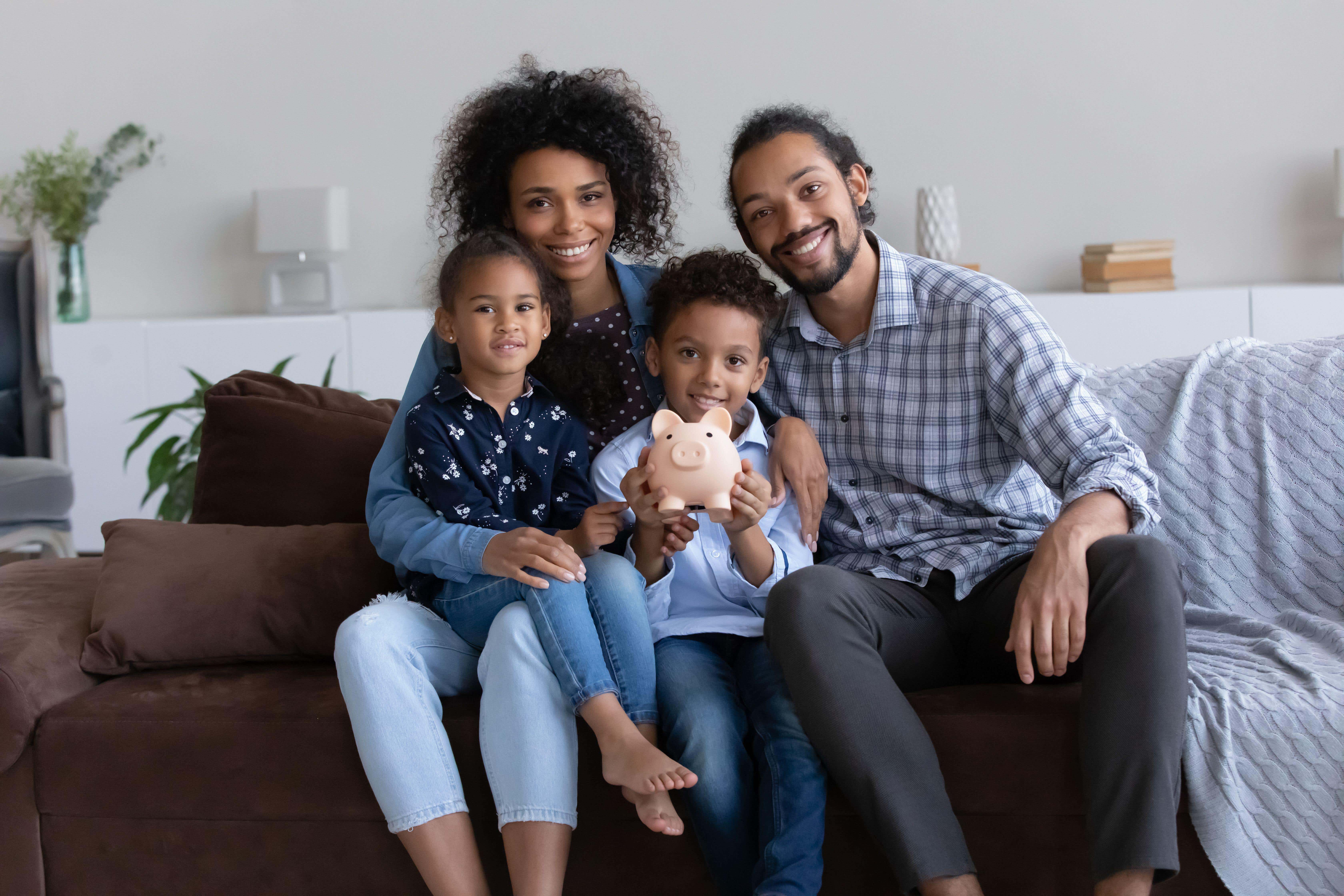 Despite the Bank of England base rate being on hold for now, parents should consider whether their children are getting the most out of their savings, say experts (Alamy/PA)