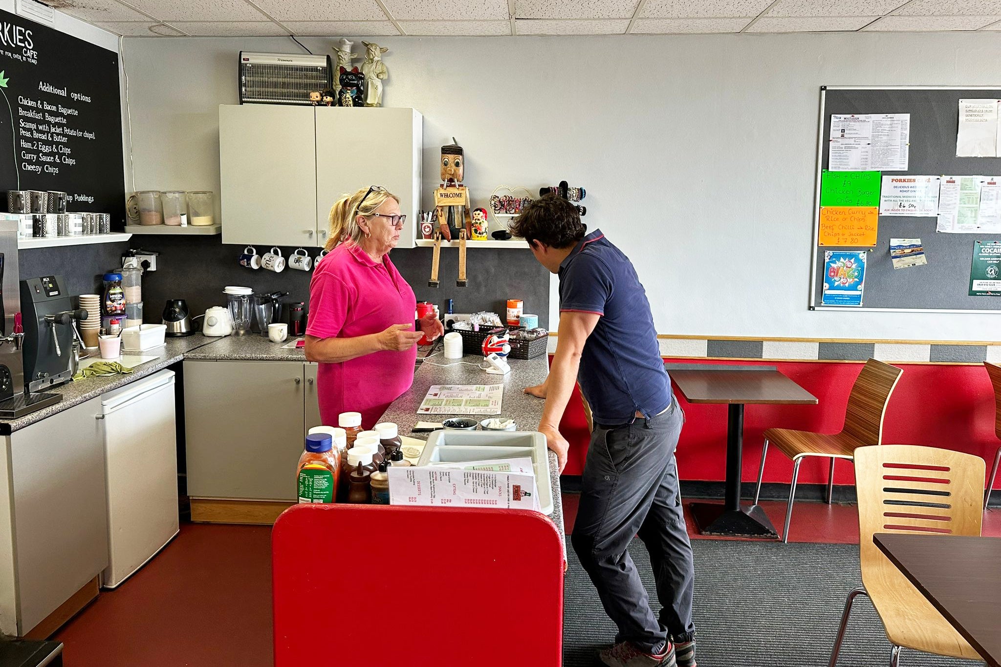 Johnny Mercer talks to Sharon Cross, manager of Porkies Cafe, before sitting down for a cheese and ham sandwich