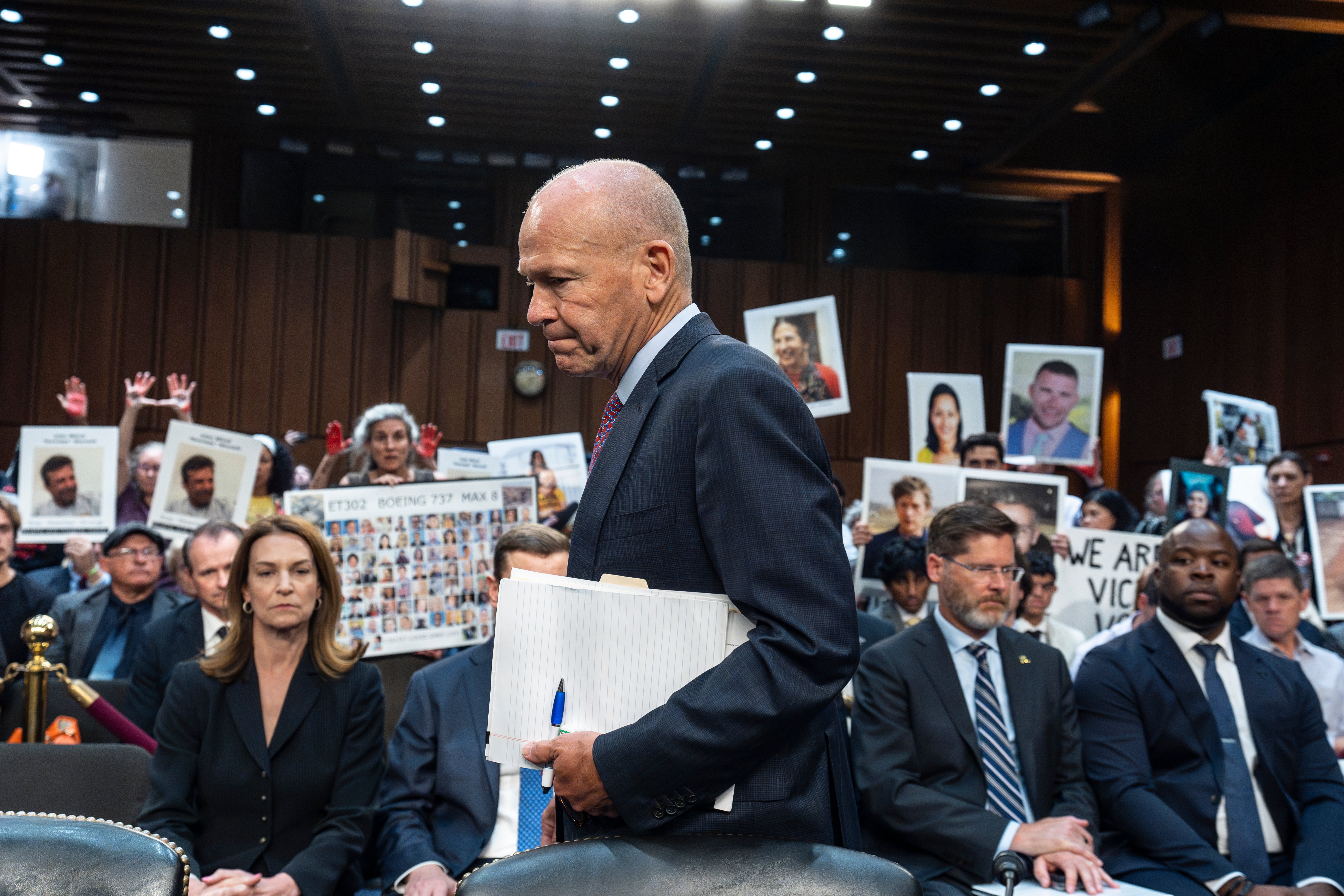 With protesters in the audience, Boeing CEO Dave Calhoun arrives at a Senate subcommittee hearing to answer to lawmakers about troubles at the aircraft manufacturer. Ike Riffel , a California father whose two sons, died in 2019 when a Boeing 737 Max jetliner crashed in Ethiopia