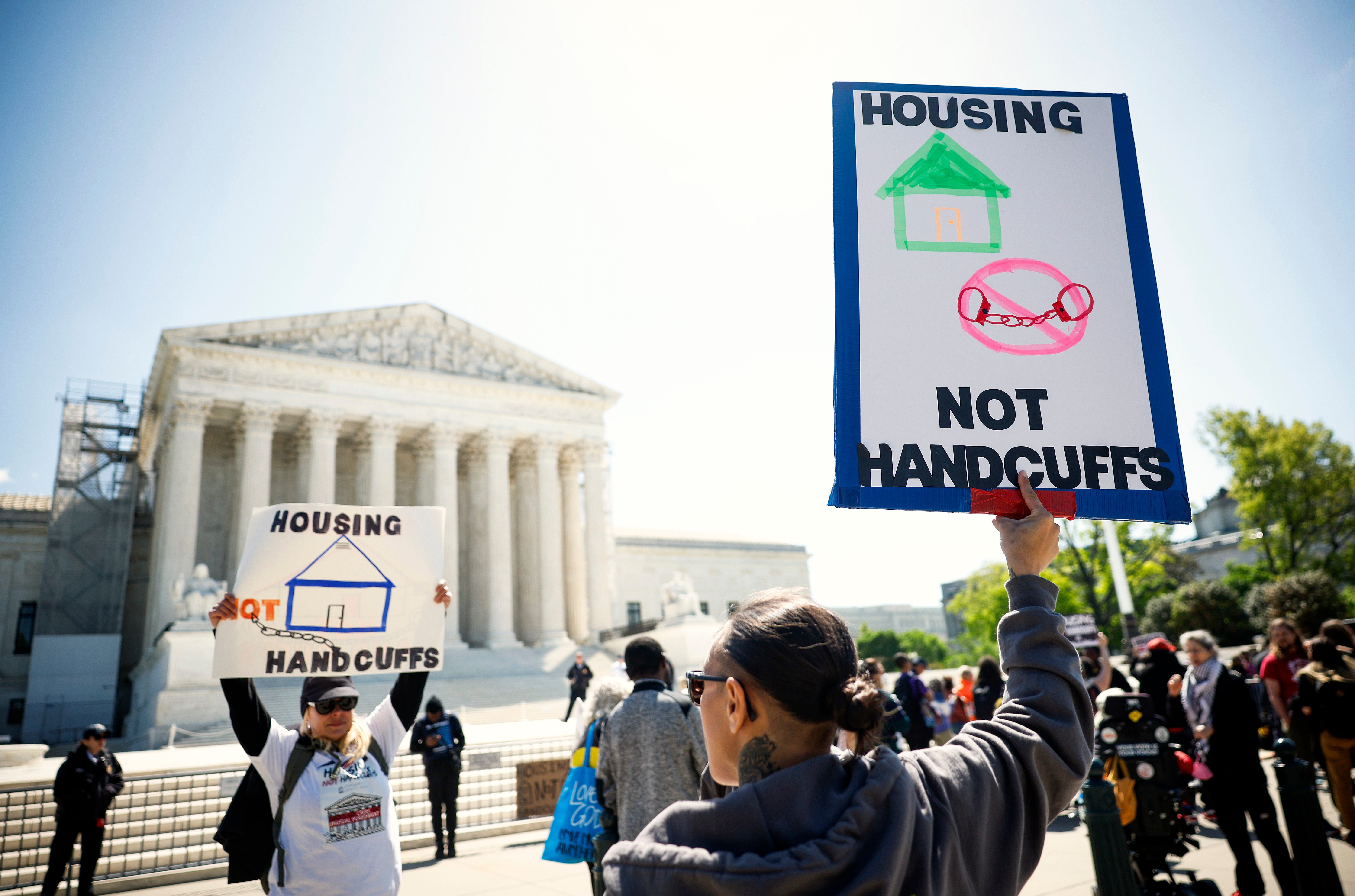 Homeless rights activists hold a rally outside pm the U.S. Supreme Court on April 22 in Washington, DC. A Supreme Court ruling allows states and cities to pass laws that ban sleeping in public places