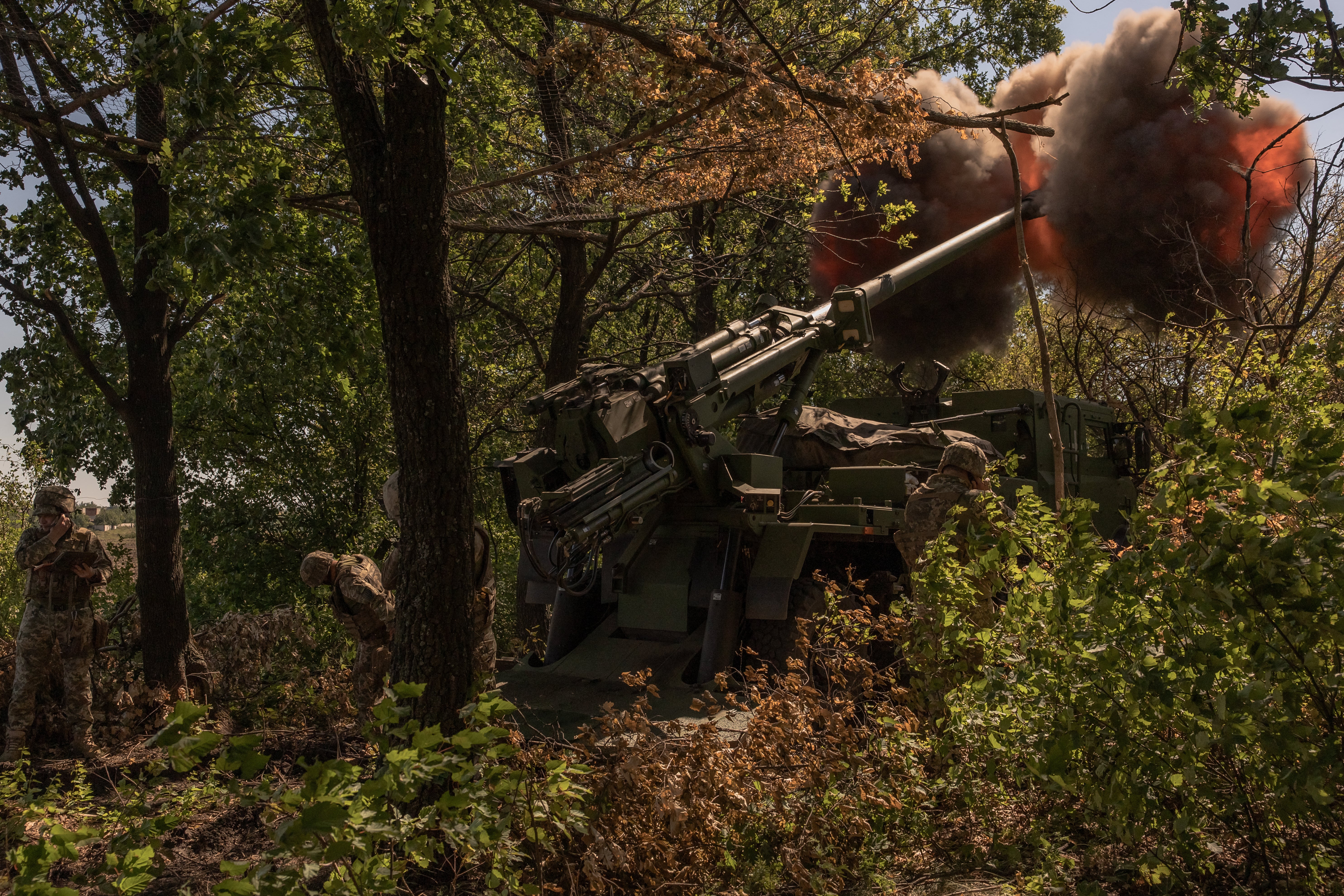 Ukrainian servicemen of the 55th Artillery Brigade "Zaporizhzhia Sich" fire a French-made CAESAR self-propelled howitzer toward Russian positions, in the Donetsk region