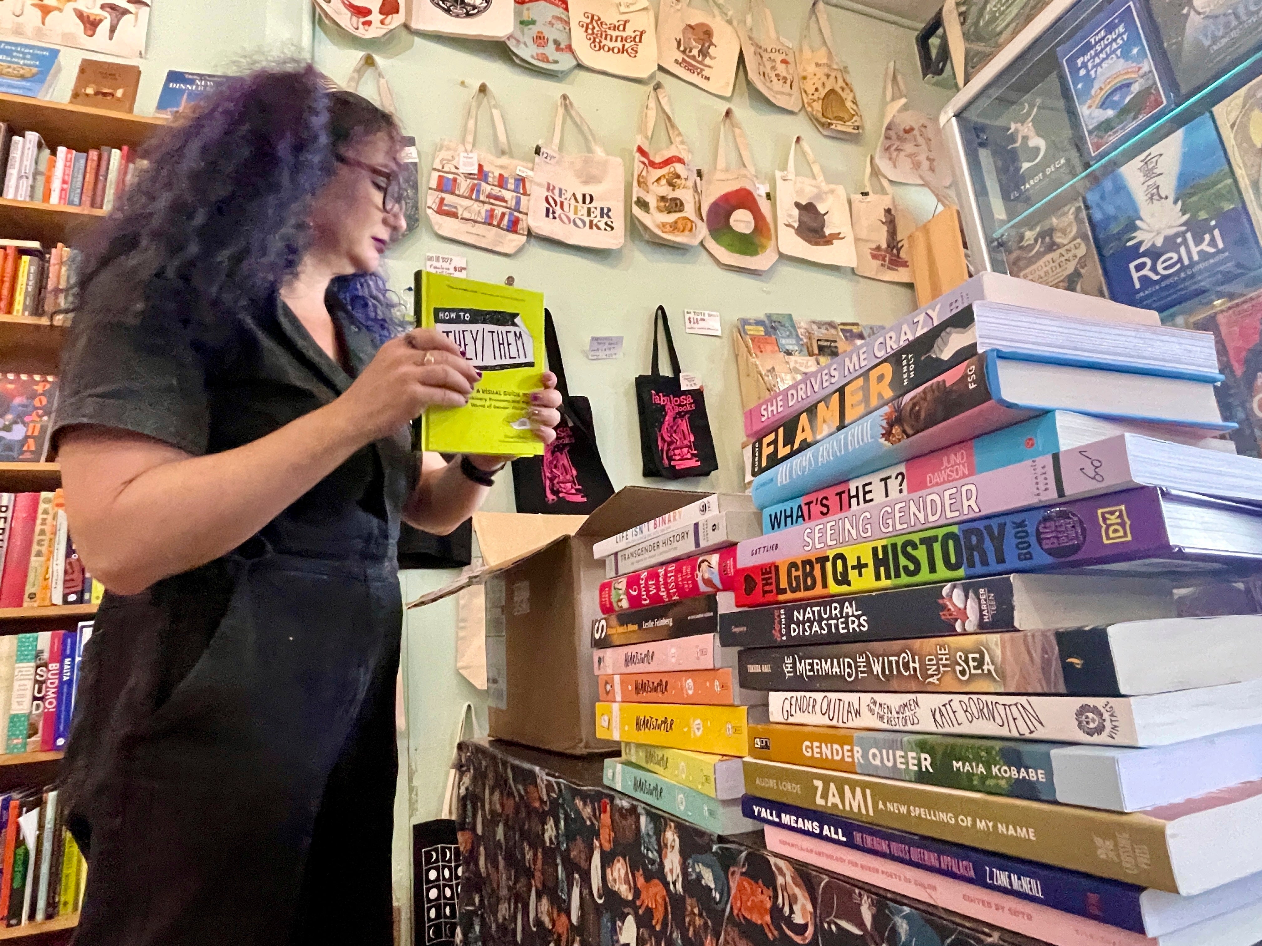 Becka Robbins, founder of the ‘Books Not Bans’ program at Fabulosa Books, packs up LGBTQ+ books in June to be sent to parts of the USA where they are censored