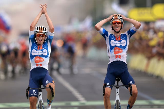 <p>Romain Bardet, right, celebrates winning stage one</p>