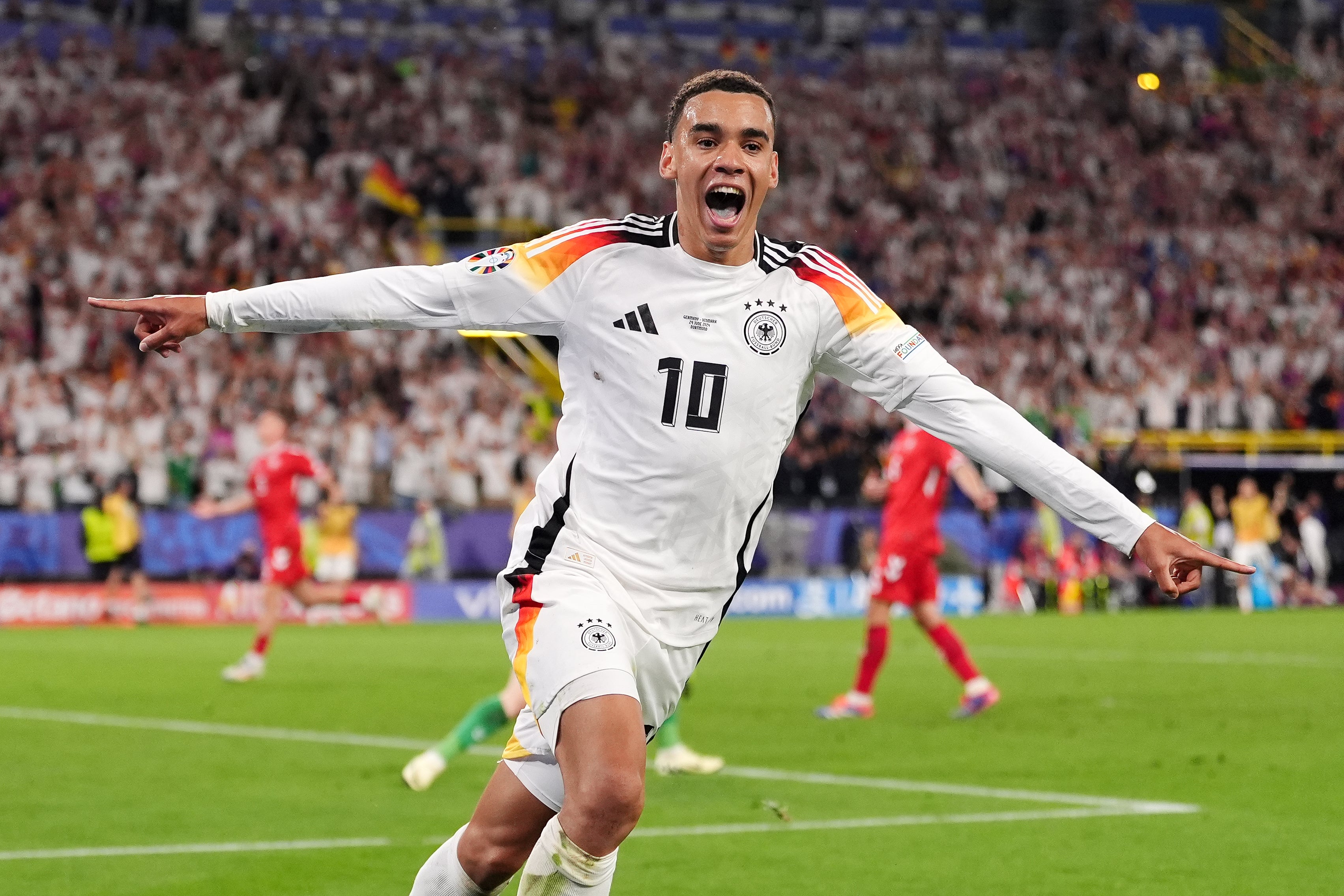 Jamal Musiala celebrates scoring Germany’s second goal against Denmark, his third of the tournament (Bradley Collyer/PA)