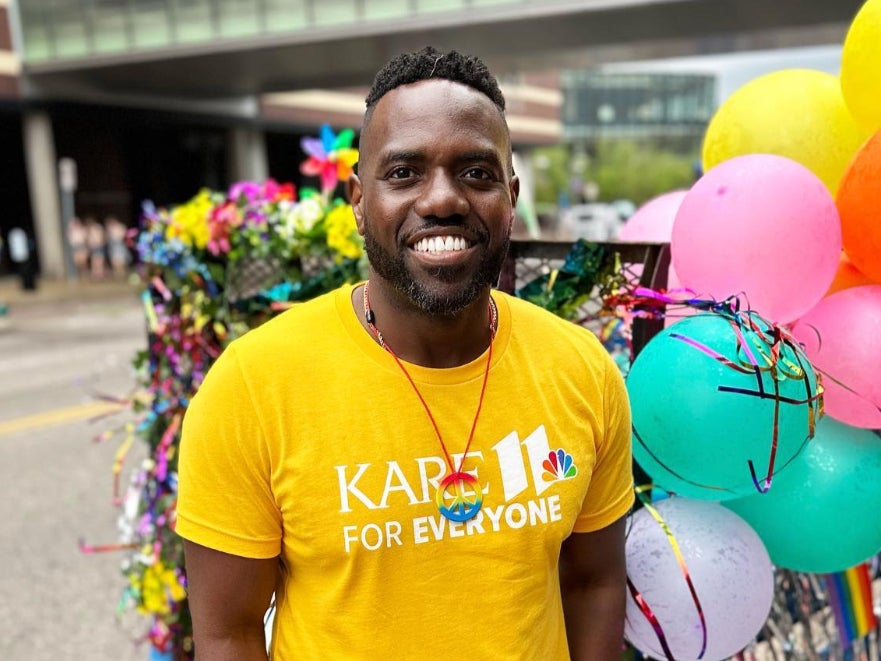 News anchor Jason Hackett poses at a Pride parade in Minneapolis, Minnesota ( @jasonhackettnews/Instagram )