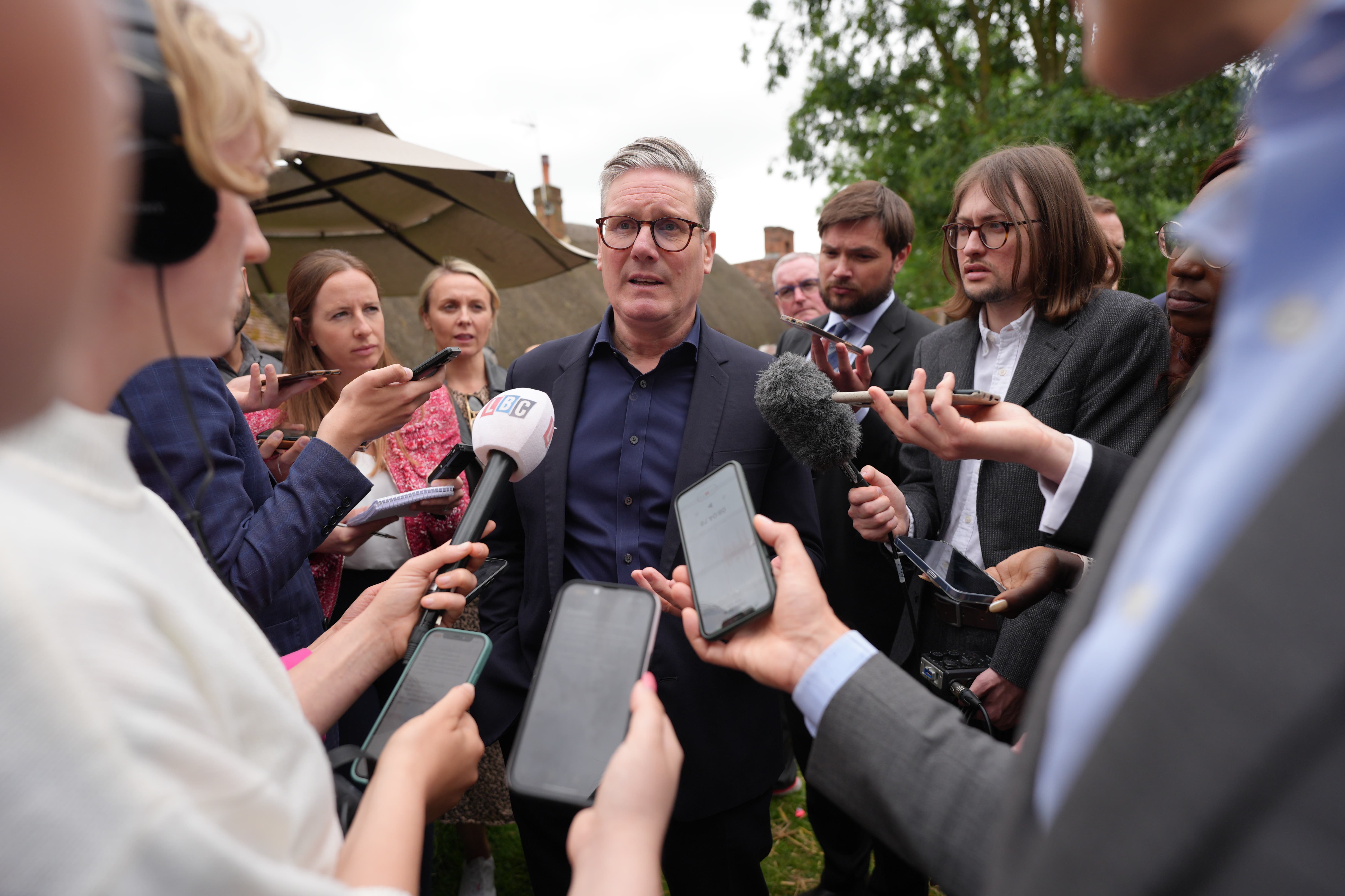 Labour leader Sir Keir Starmer speaks to the media during a visit to the Shoulder of Mutton Pub in Little Horwood (PA)