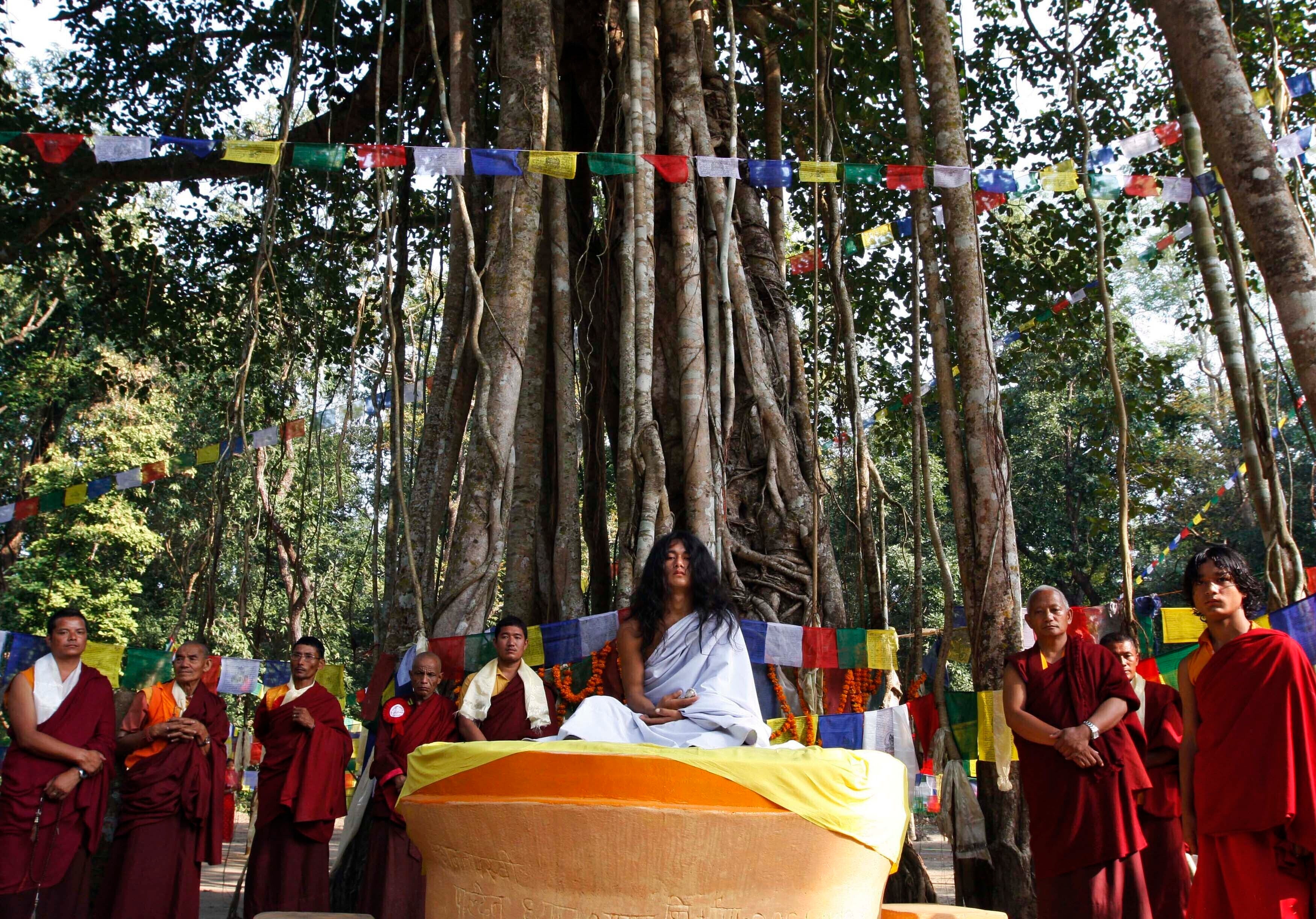 Ram Bahadur Bamjan, center in white, is surrounded by Buddhist monks in Nijgadh town, south of Katmandu, Nepal