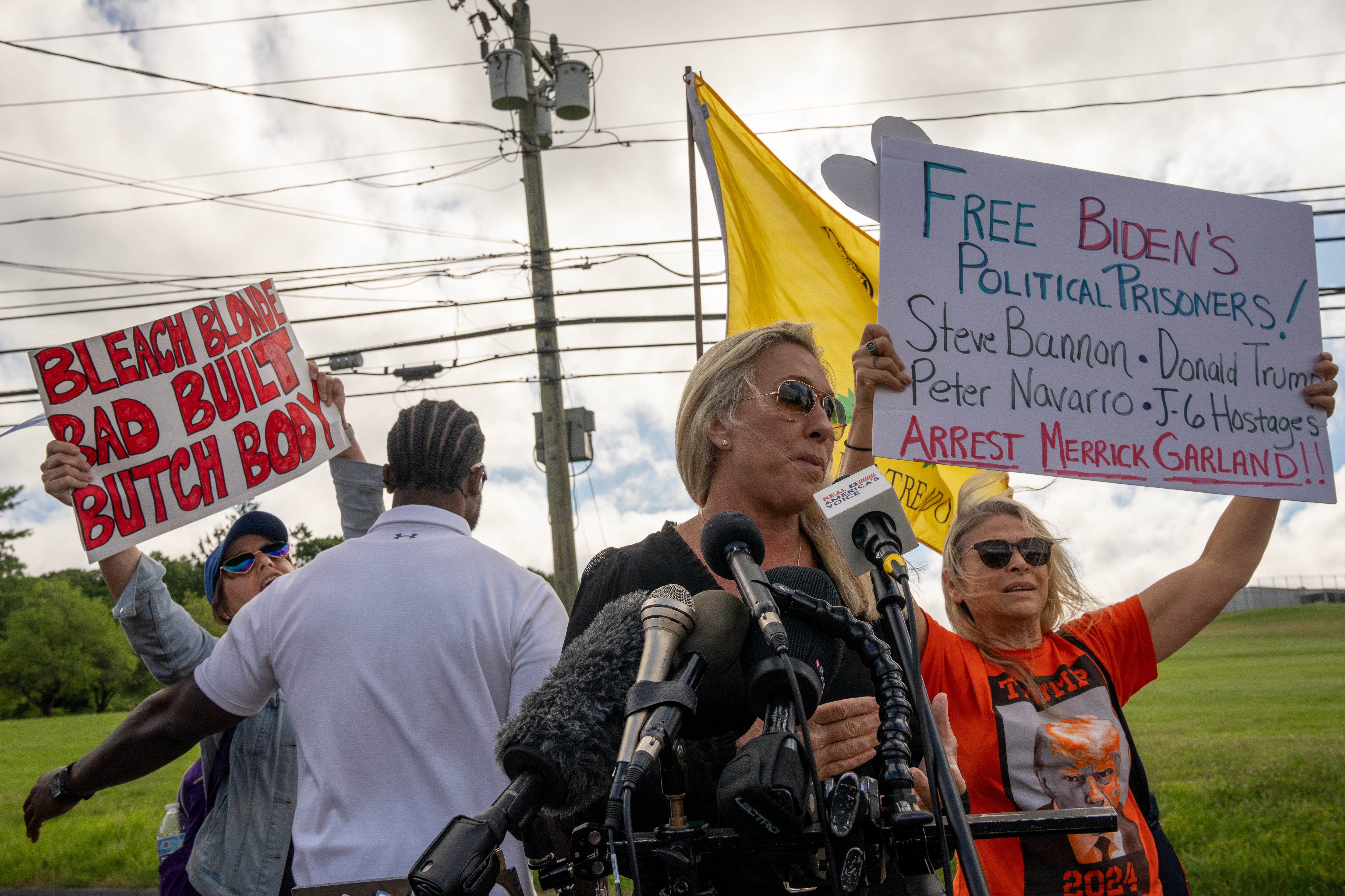 Congresswoman Marjorie Taylor Greene addresses the media at the Federal Correctional Institution Danbury on July 1 as Steven Bannon’s four-month prison sentence gets underway