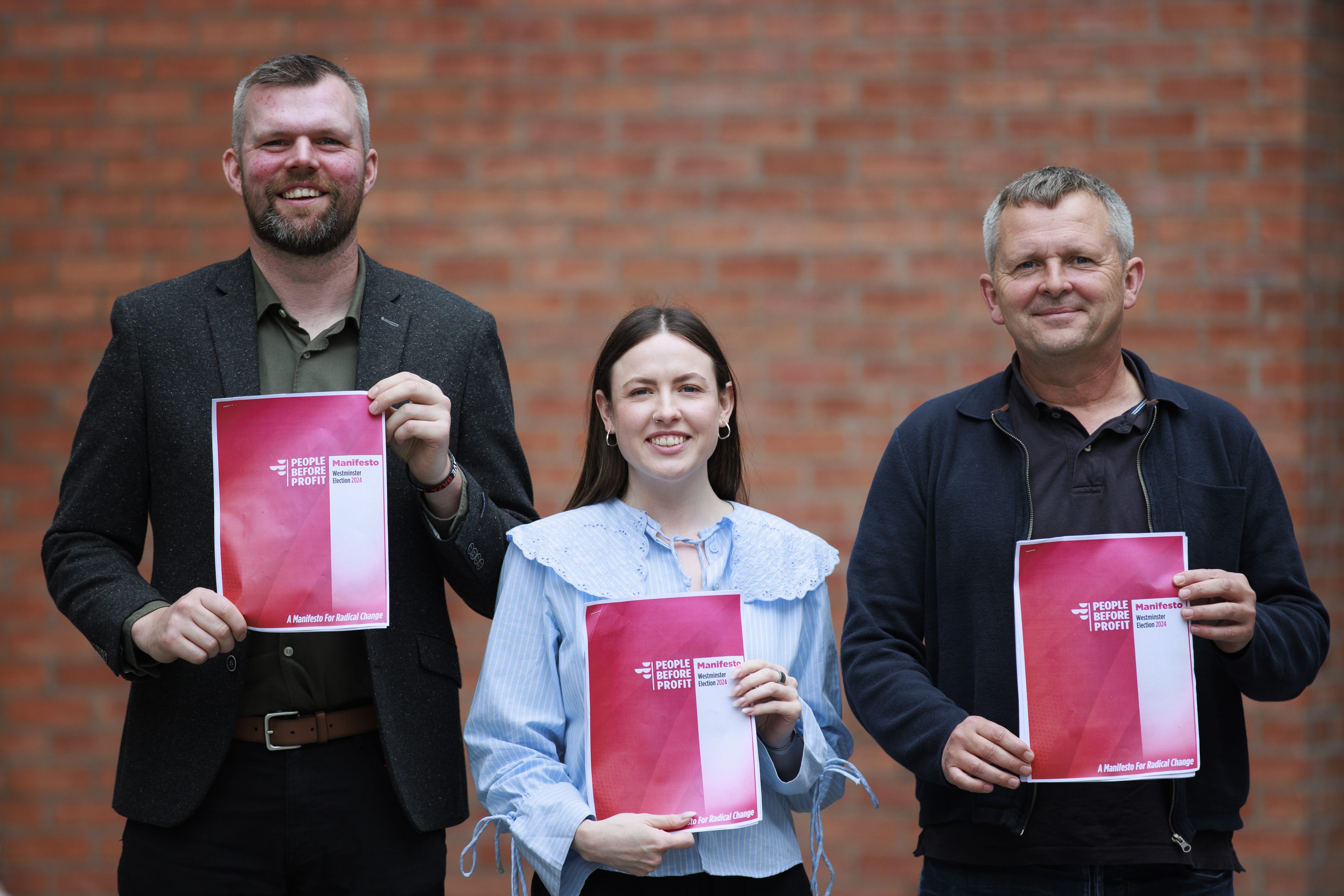 (left to right) Gerry Carroll, Westminster parliamentary candidate for West Belfast, and Fiona Ferguson, Westminster parliamentary candidate for Belfast North, with Richard Boyd Barrett TD holding copies of the People Before profit General Election manifesto launch at The Mac Belfast. Picture date: Monday July 1, 2024.