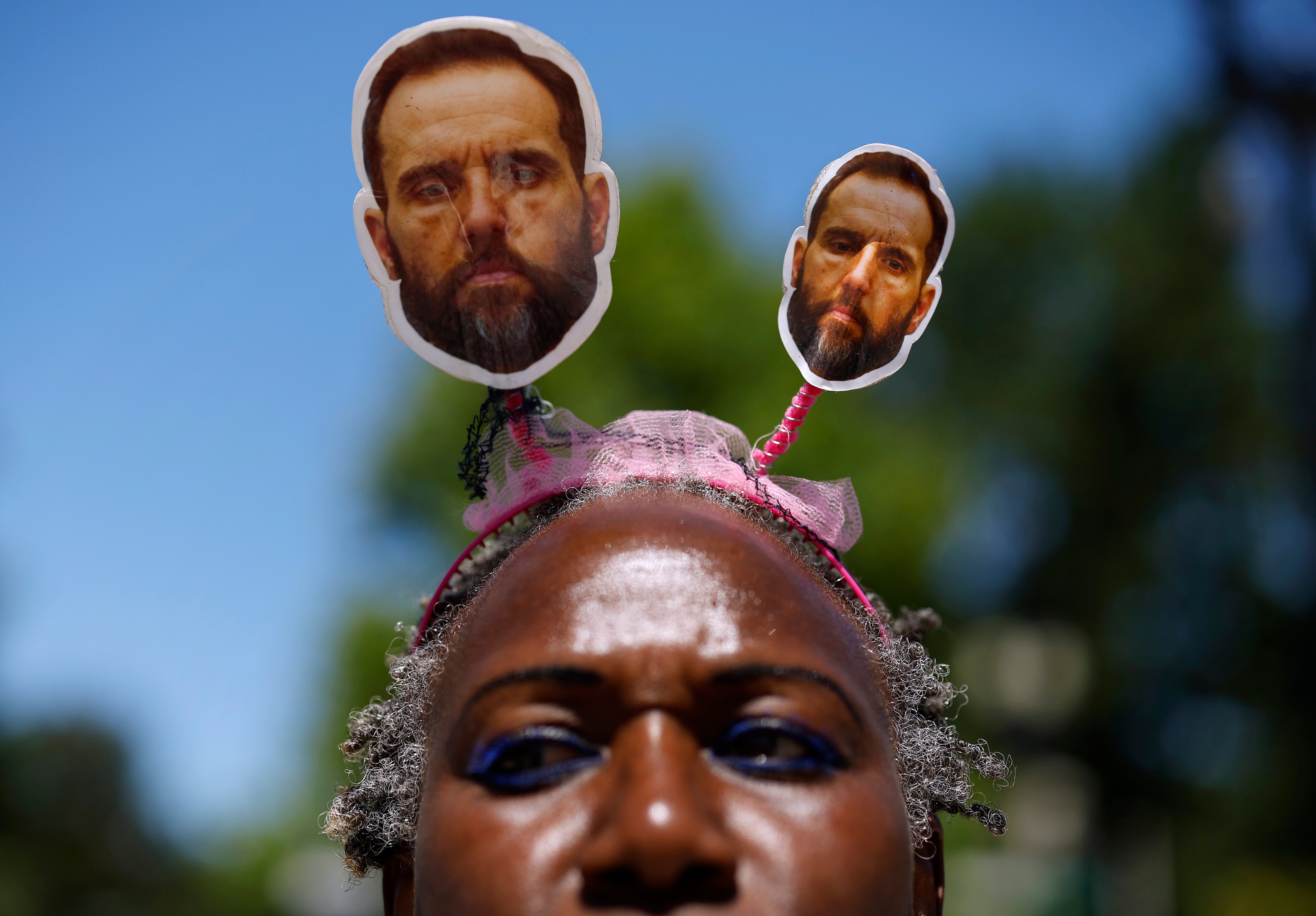 Demonstrator Nadine Seiler wears a headband with images of special counsel Jack Smith while waiting outside the Supreme Court on July 1.