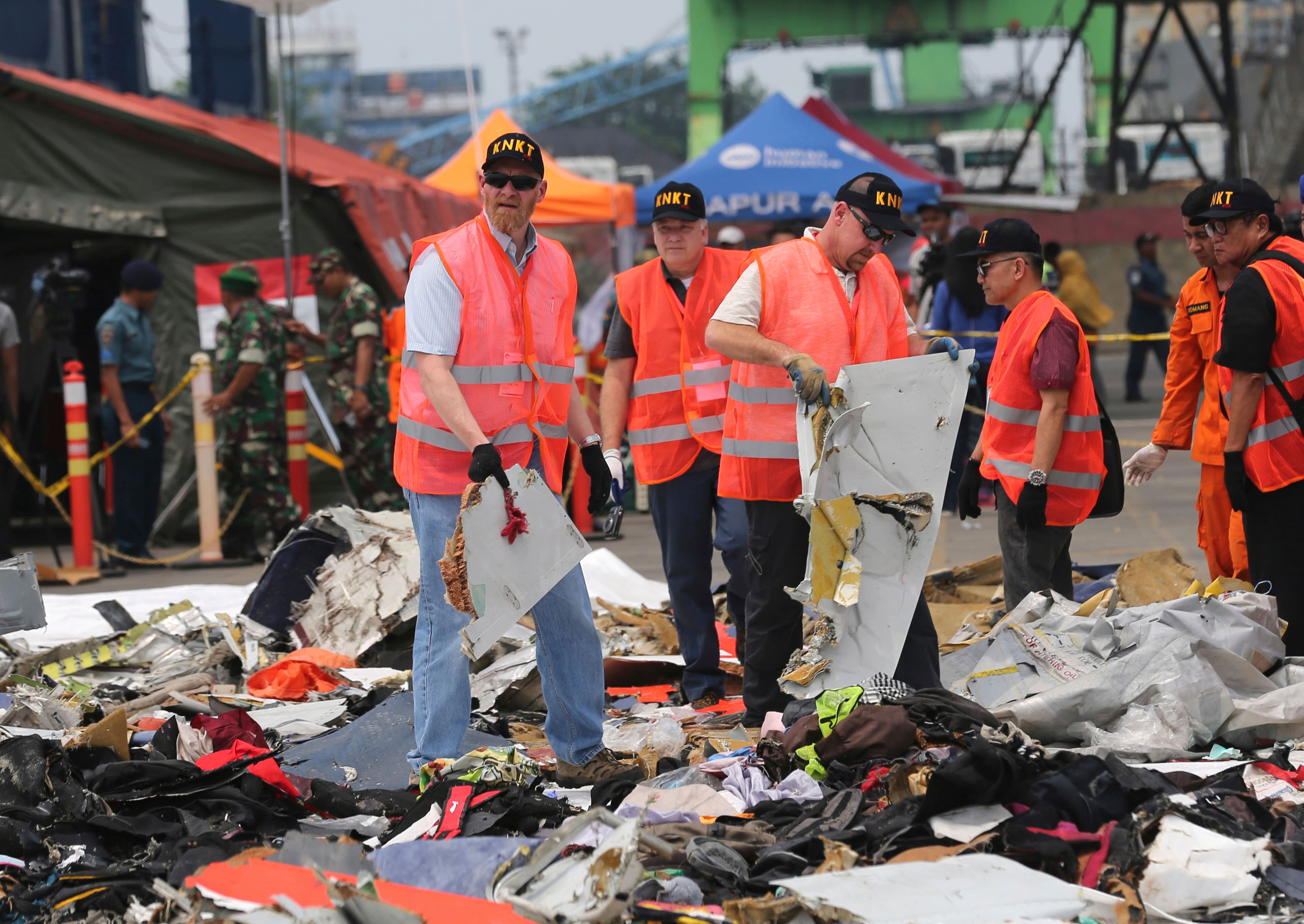 US investigators examine parts recovered from the crash of a Lion Air jet at Tanjung Priok Port in Jakarta, Indonesia