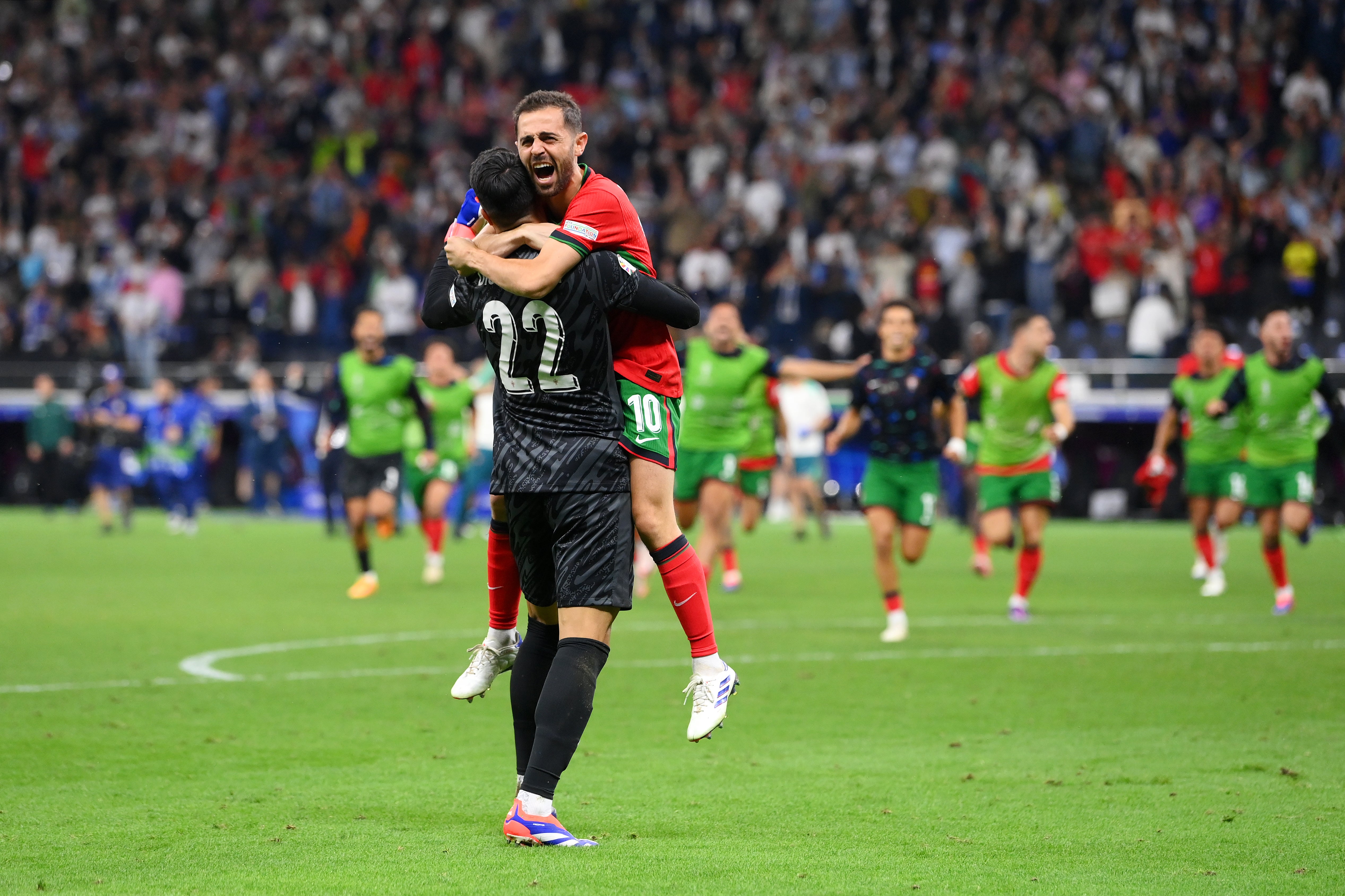 Bernardo Silva celebrates with Diogo Costa