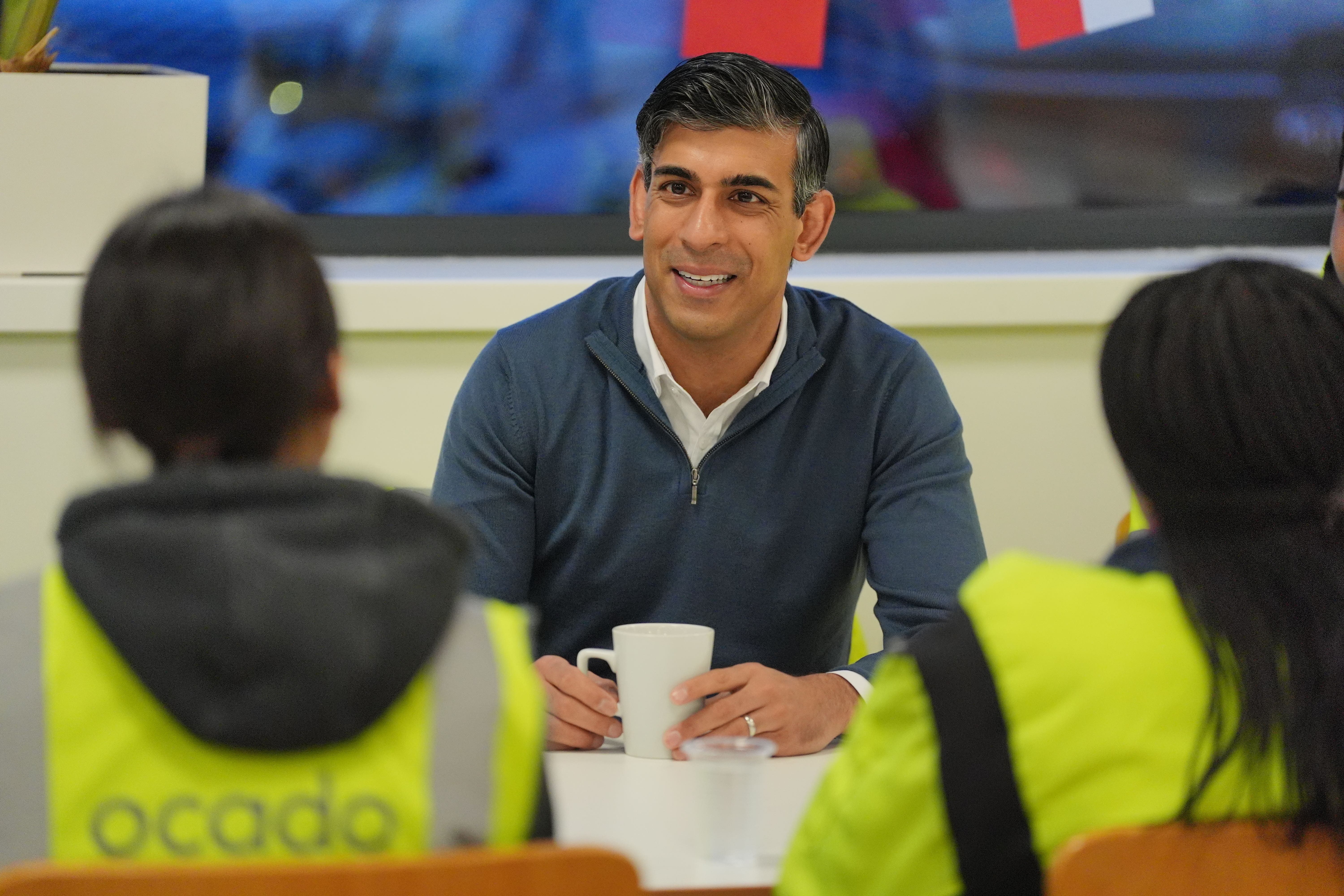 Prime Minister Rishi Sunak during an early morning visit to an Ocado packing plant in Luton (Jonathan Brady/PA)