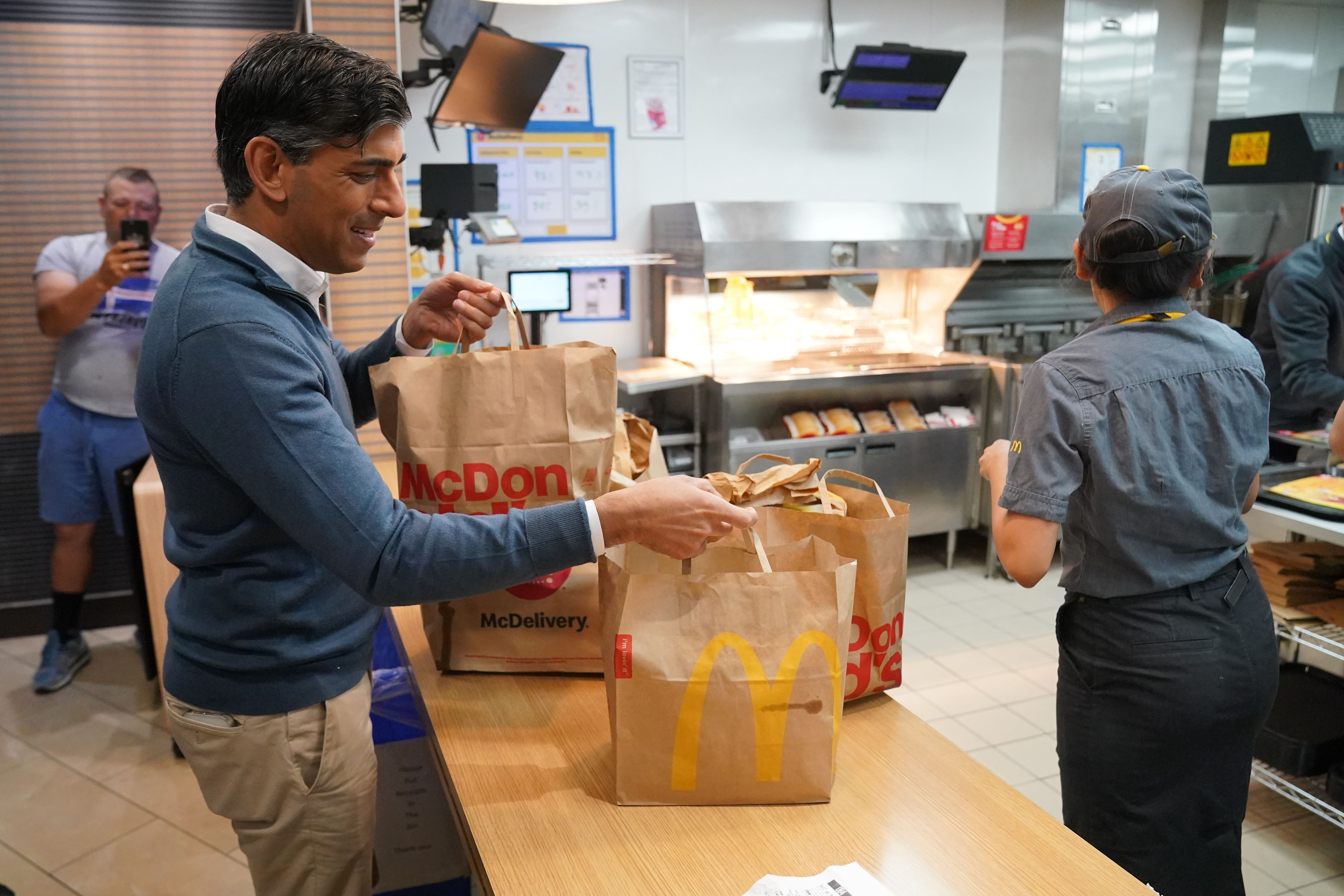 Former prime minister Rishi Sunak bought breakfast for those on the Tory battle bus at Beaconsfield Services in Buckinghamshire ( Jonathan Brady/PA)