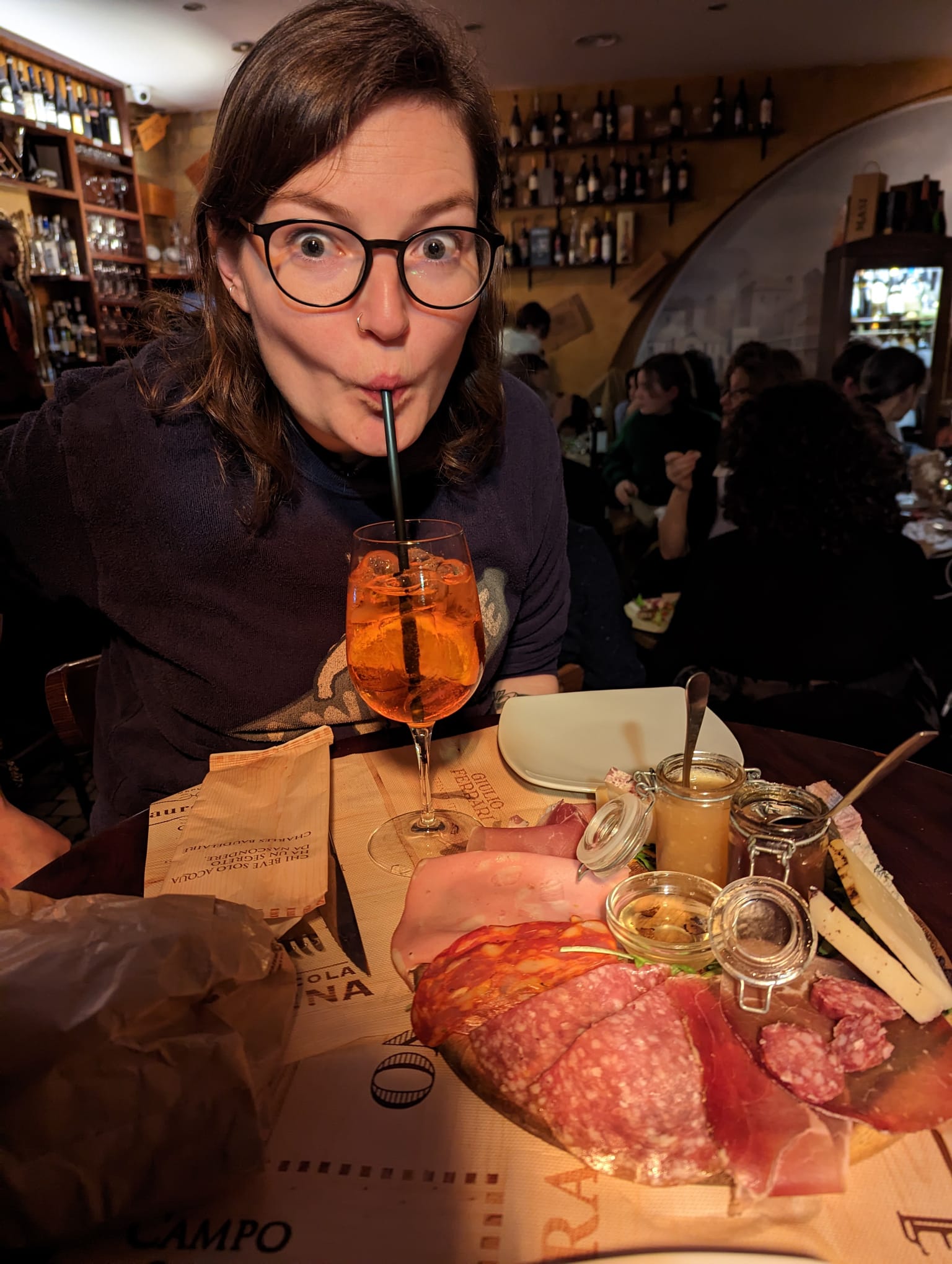 The writer enjoys an Aperol spritz and prosciutto de parma