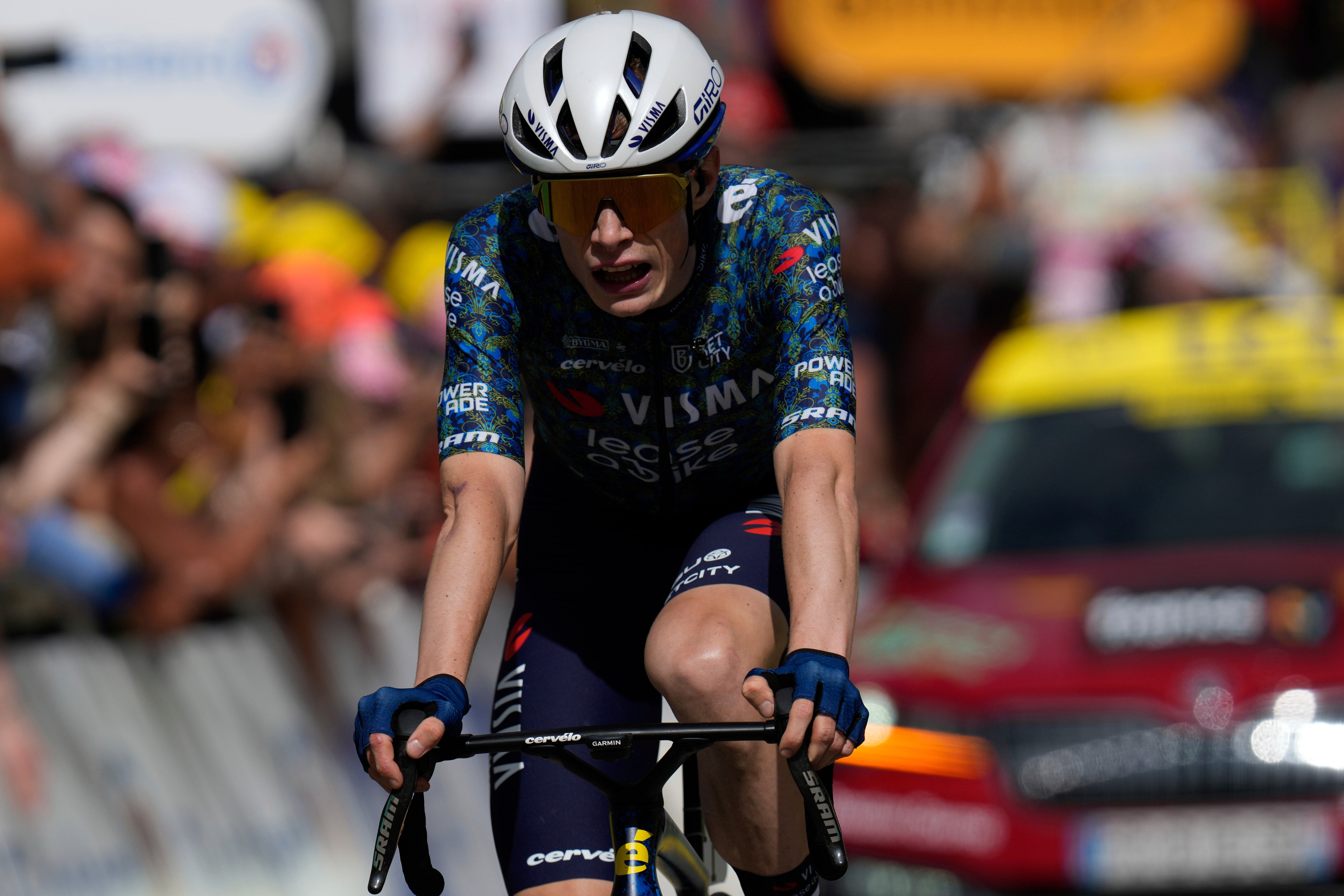 Defending champion Jonas Vingegaard sits third overall after losing time on the descent (Jerome Delay/AP)