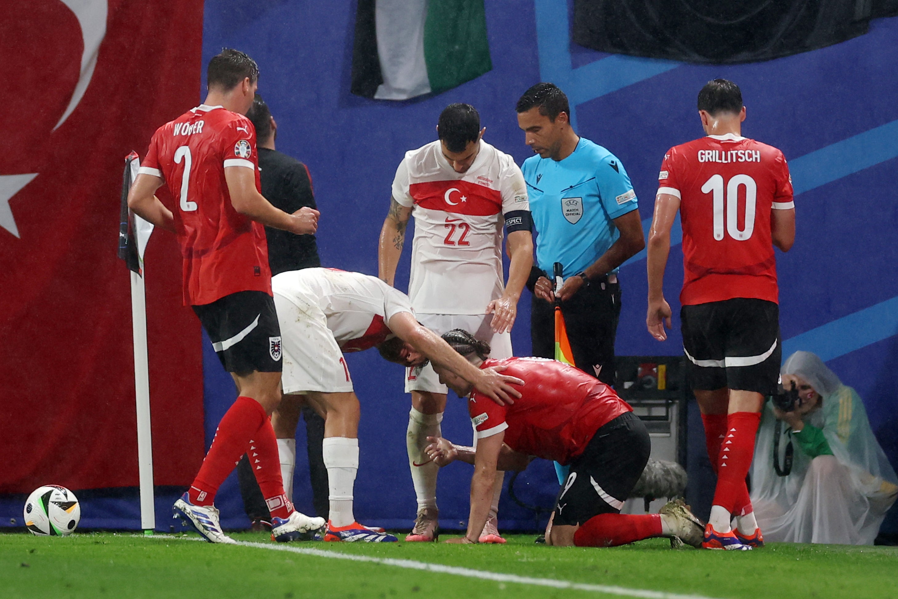 Marcel Sabitzer was attended to by a couple of Turkey players