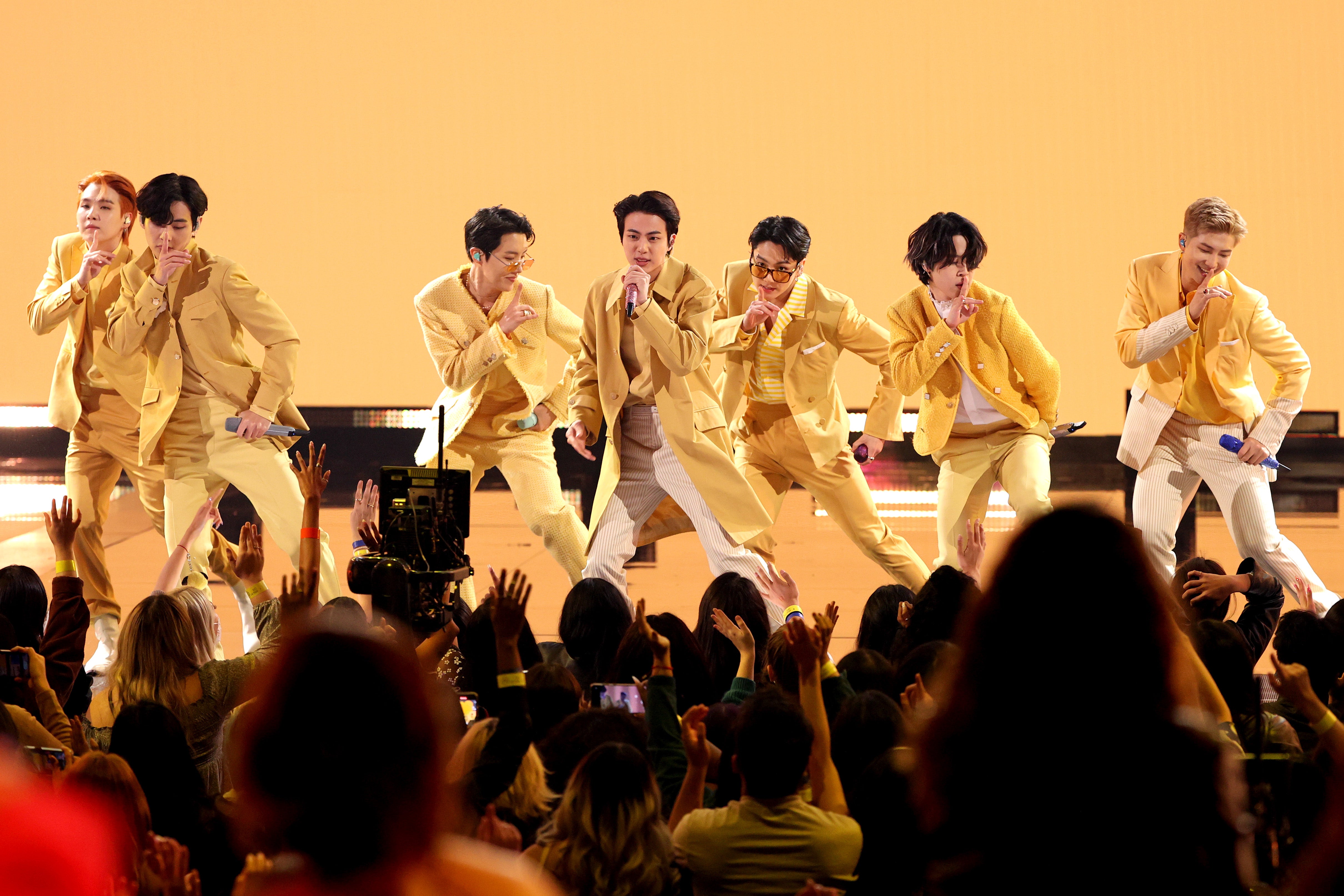 Suga, V, J-Hope, Jin, Jungkook, Jimin and RM of BTS perform during the 2021 American Music Awards at Microsoft Theater in Los Angeles