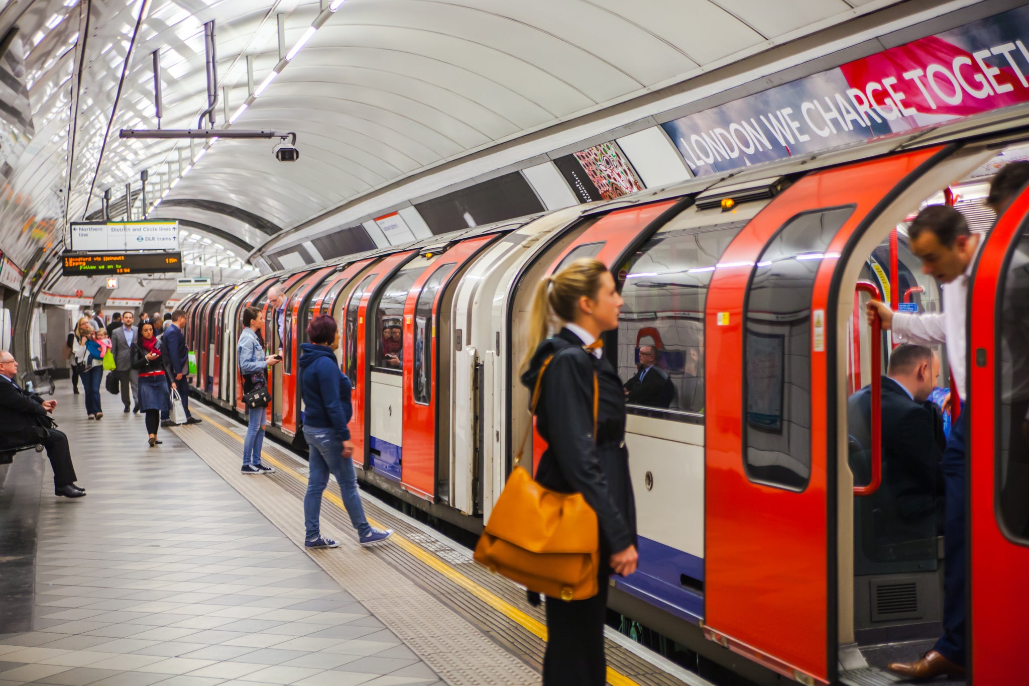 Passengers waiting for a train at an underground tube platform