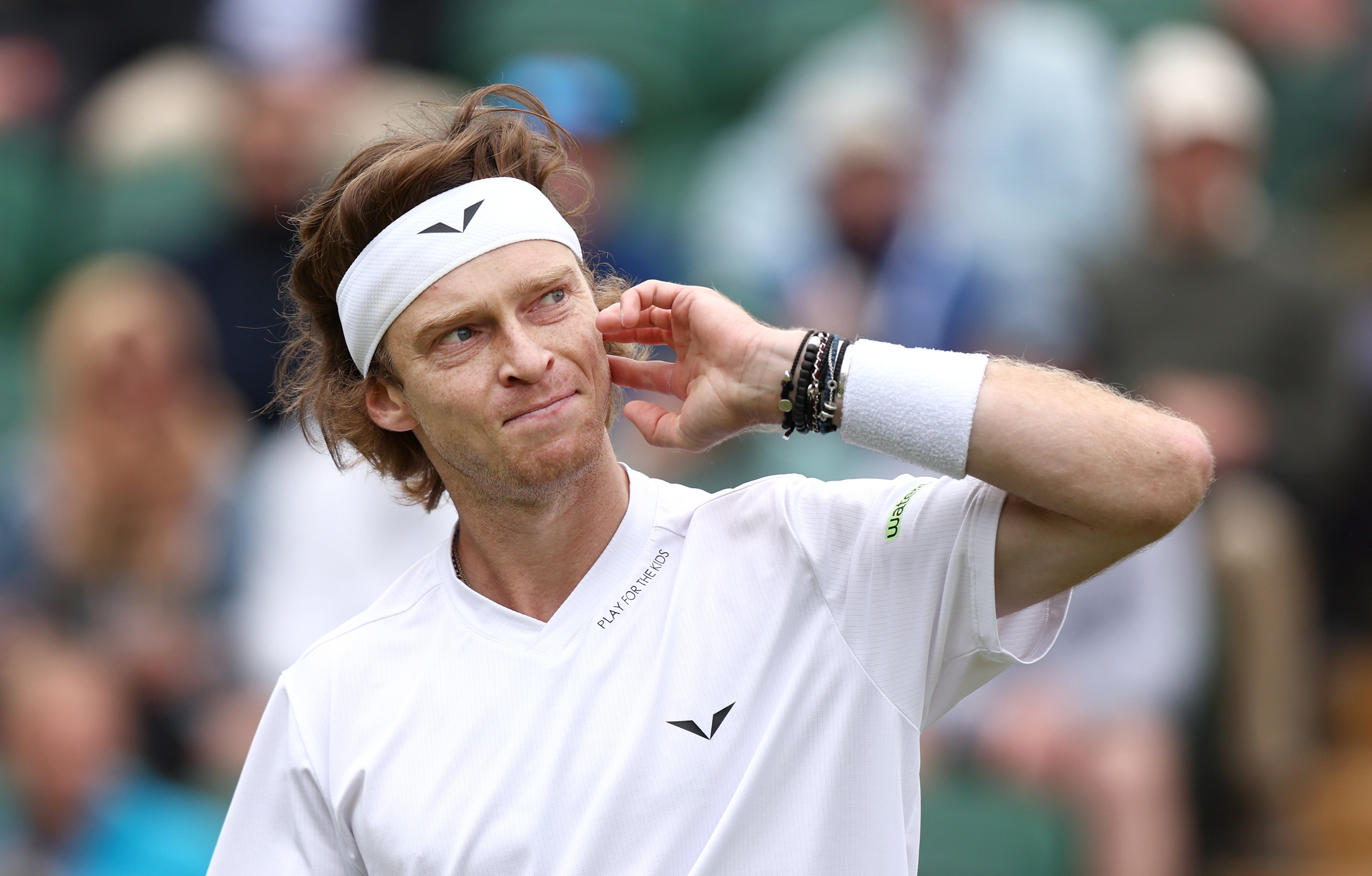 Andrey Rublev reacts as he plays against Francisco Comesana