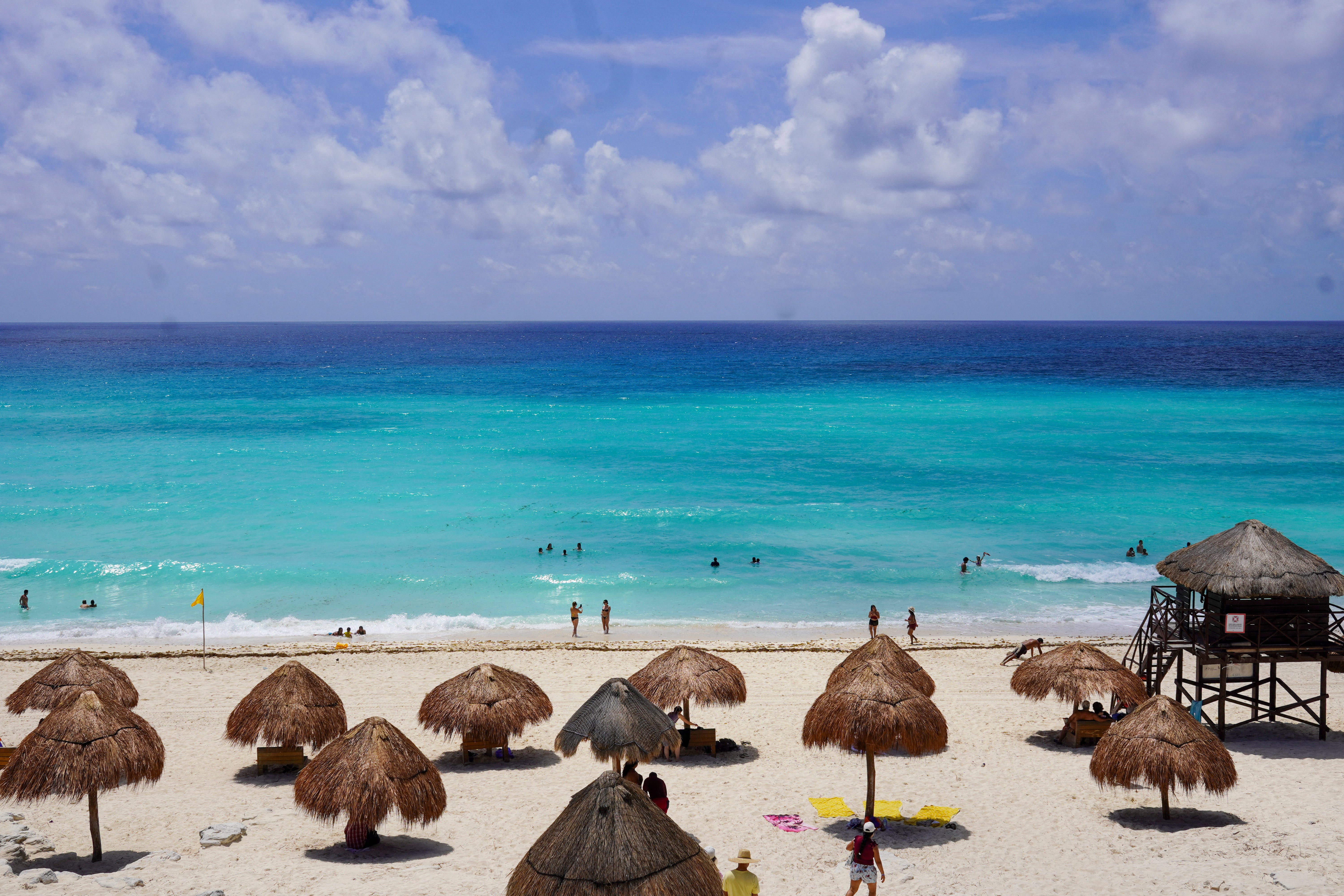 Tourists are pictured on the beach in Cancun