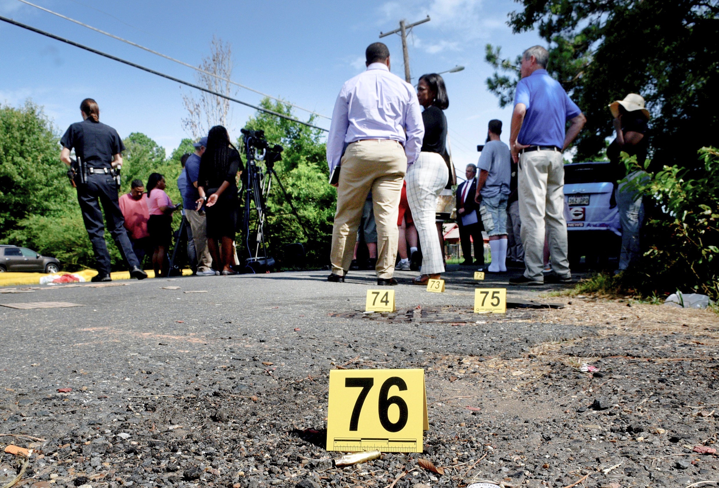 Bullet casings litter the ground behind a press conference on July 5, 2023, in Shreveport, LA