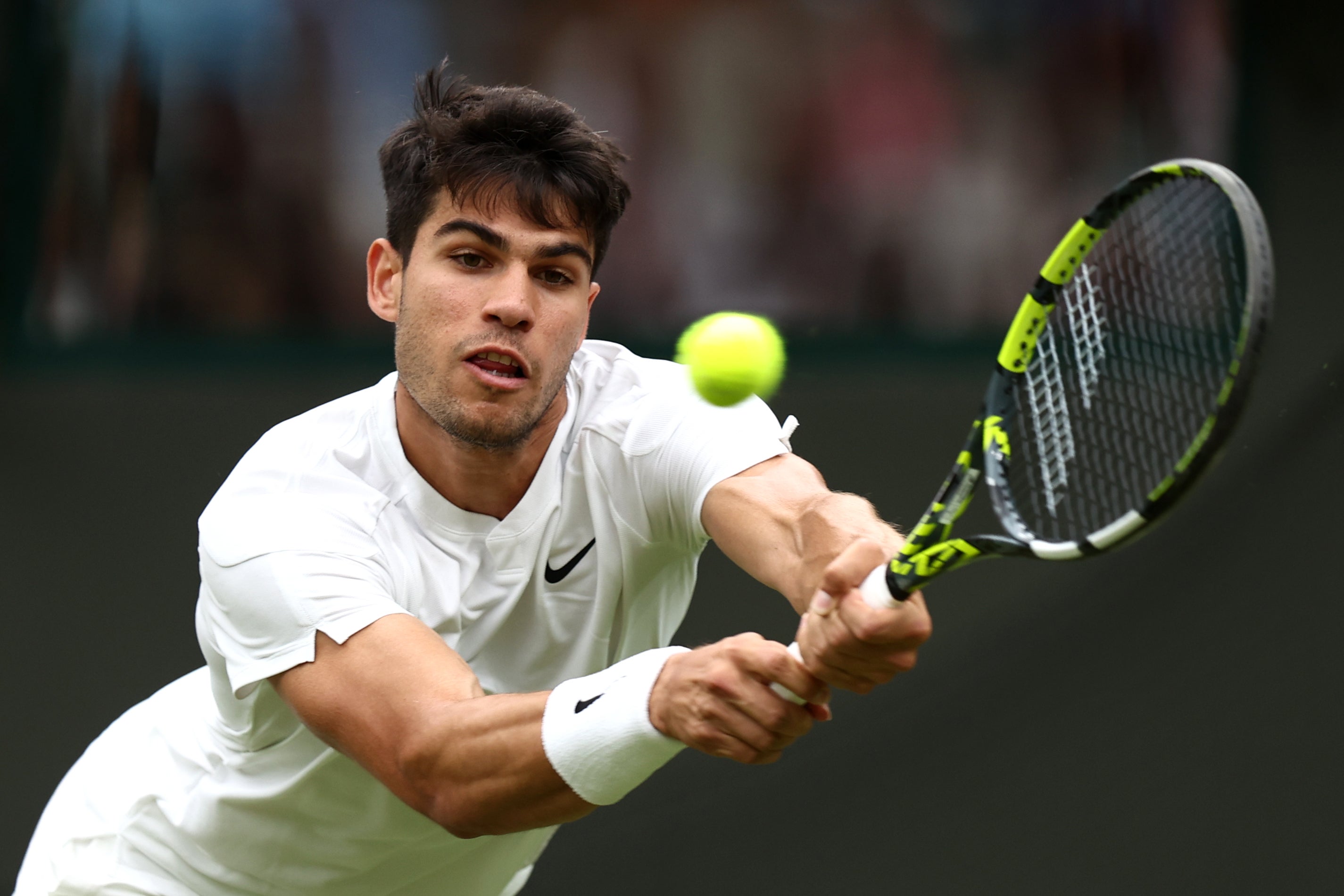 Alcaraz hits a backhand against Vukic in the second round