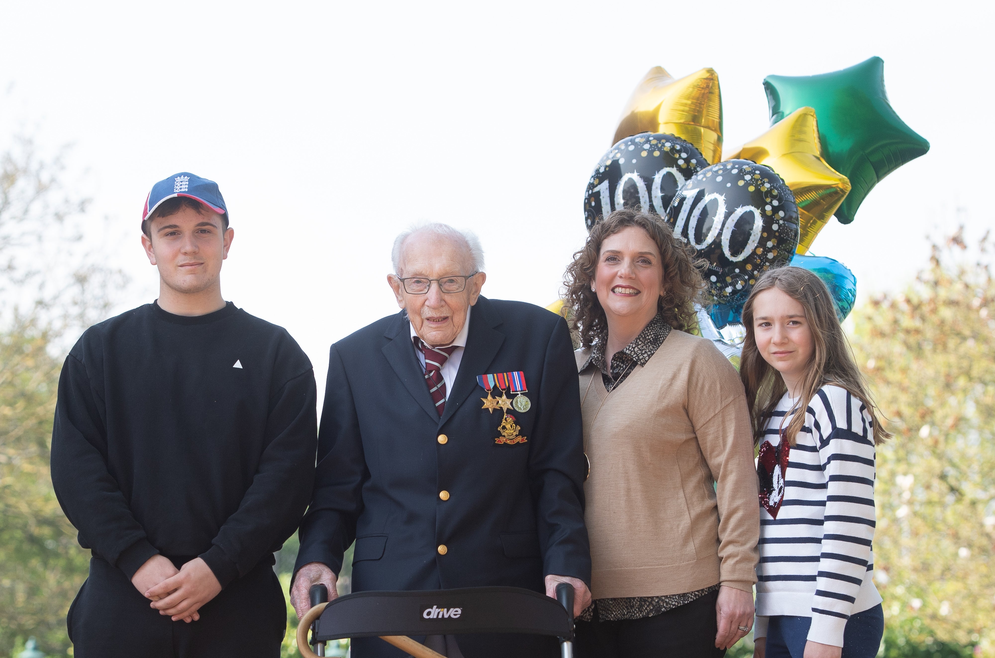 Captain Sir Tom Moore (second left) with his daughter Hannah Ingram-Moore (second from right) (Joe Giddens/PA)