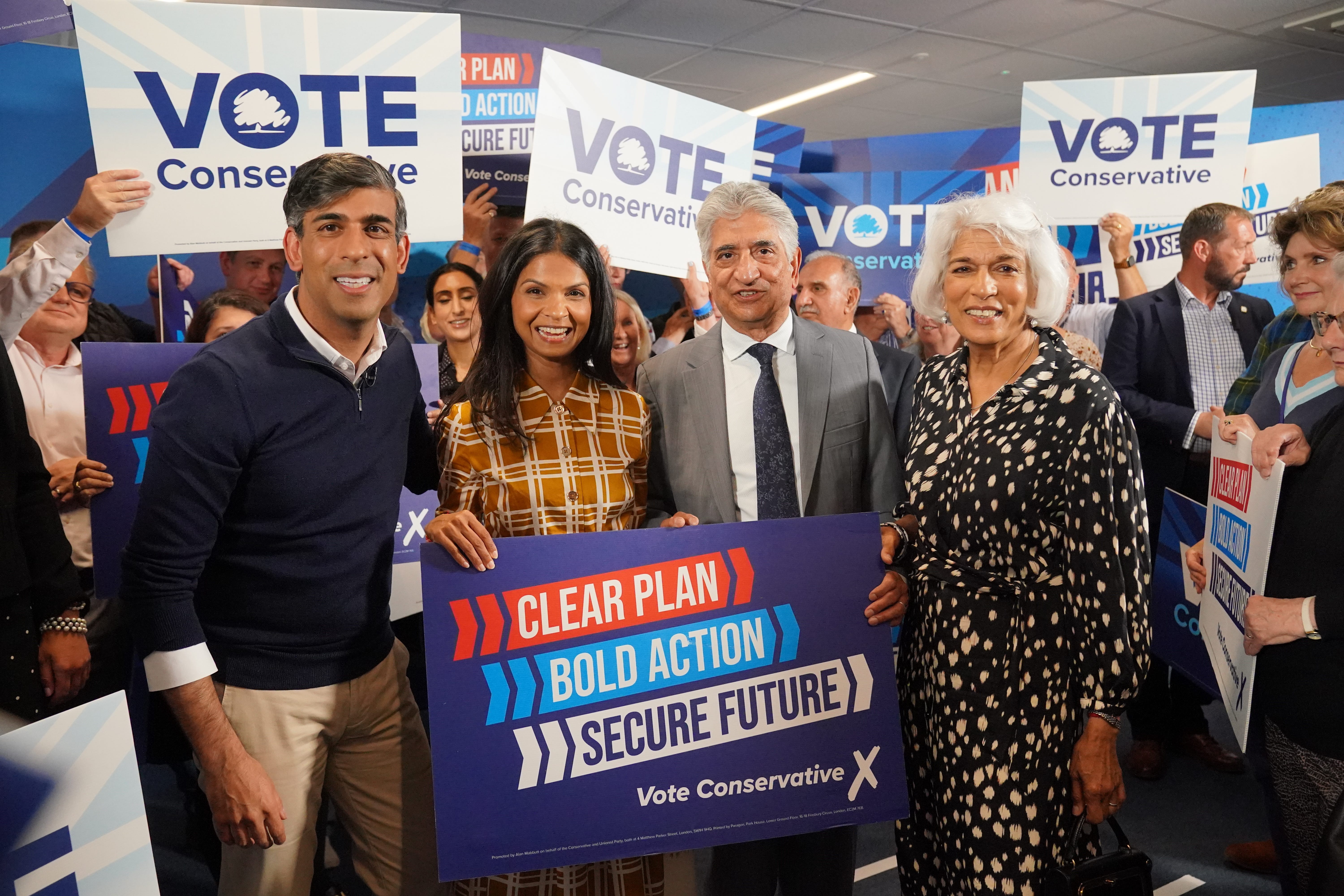 (left-right) Prime Minister Rishi Sunak, his wife Akshata Murty and his parents Usha and Yashvir Sunak at Romsey Rugby Club in Hampshire (Jonathan Brady/PA)