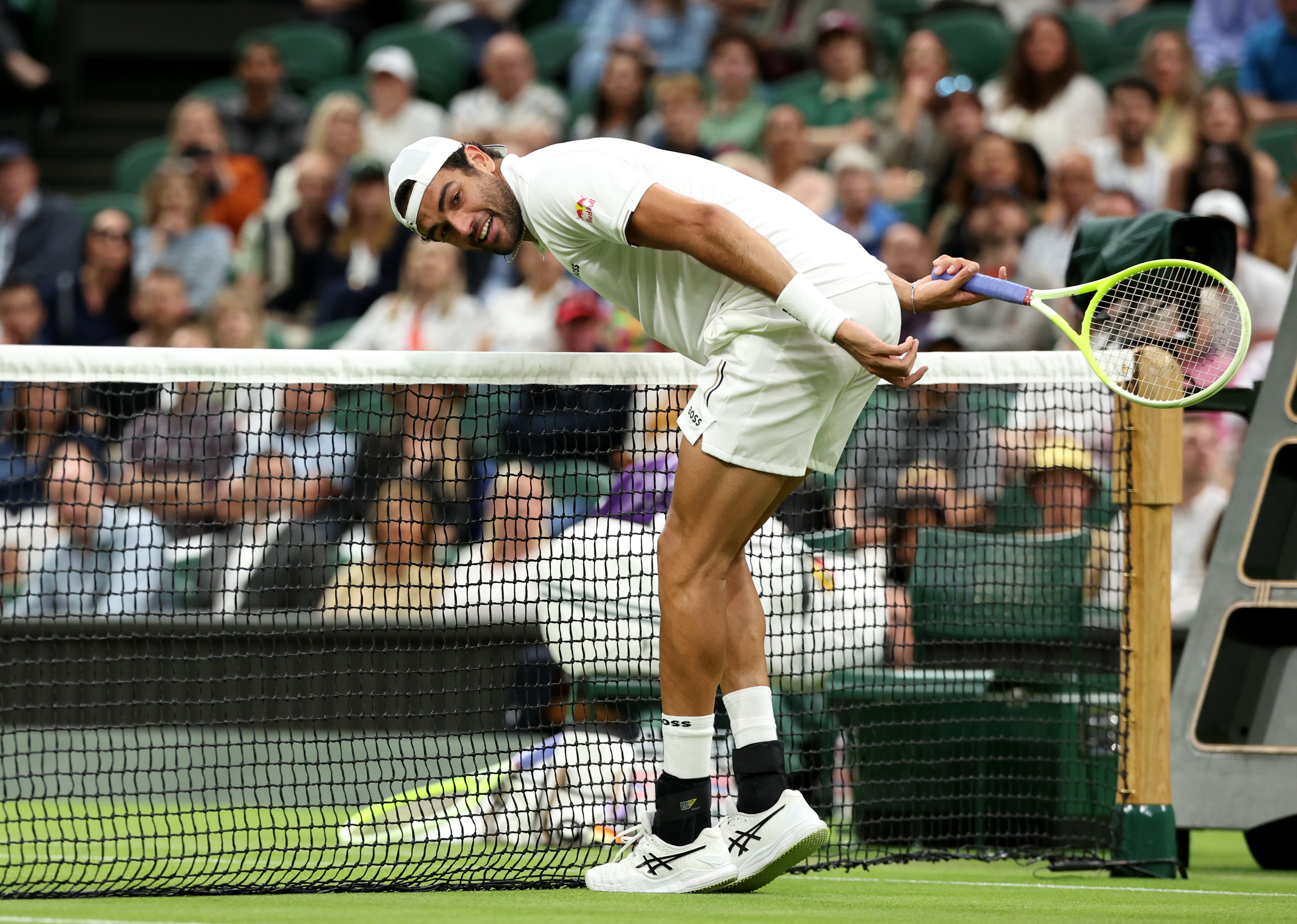 Berrettini is lured to the net as Sinner beats him with a lob