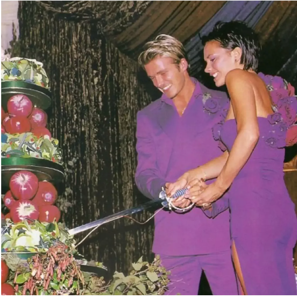 David and Victoria Beckham wore matching purple Antonio Berardi outfits to their wedding reception in 1999