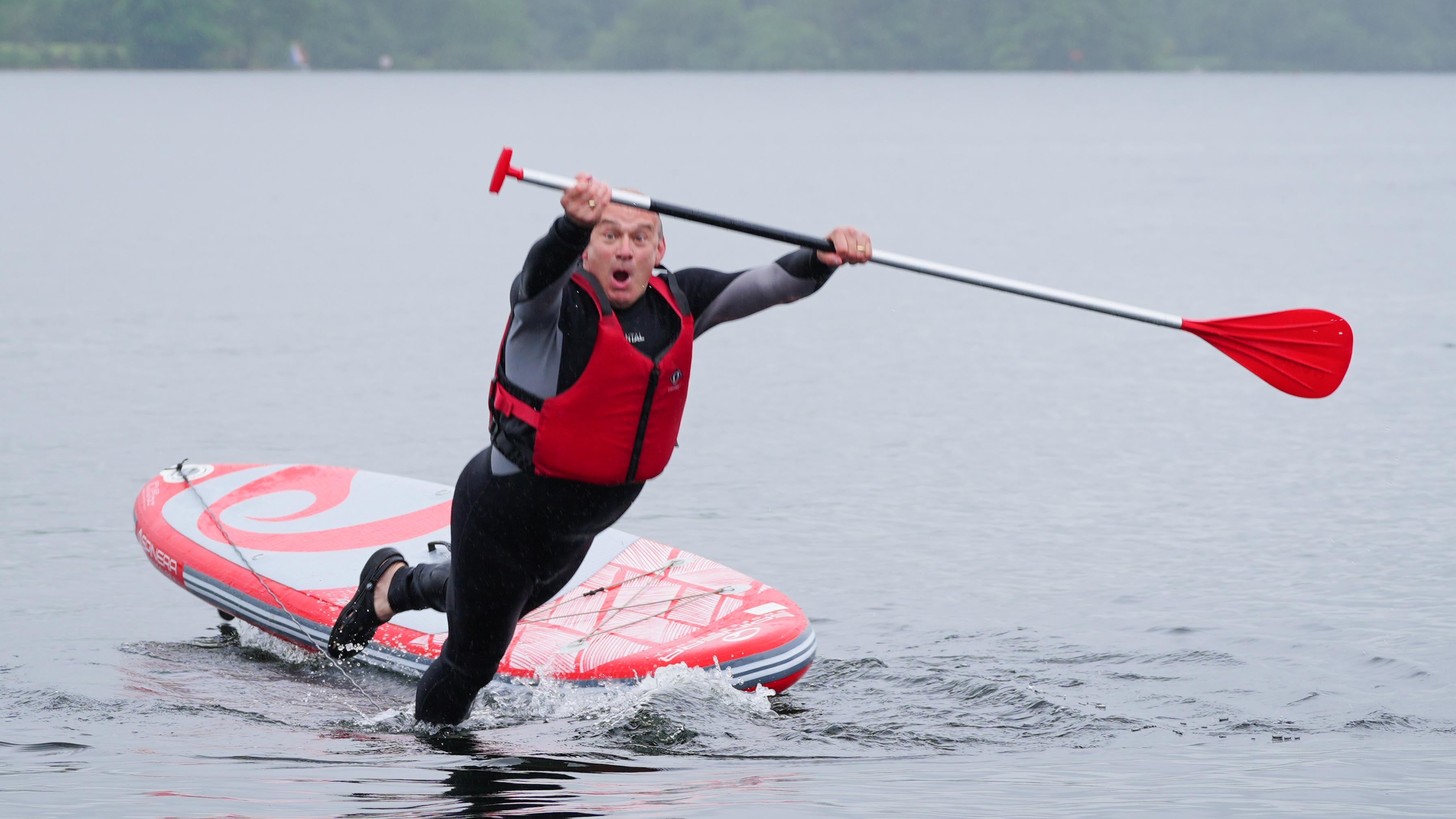 Sir Ed Davey takes the plunge (Peter Byrne/PA)