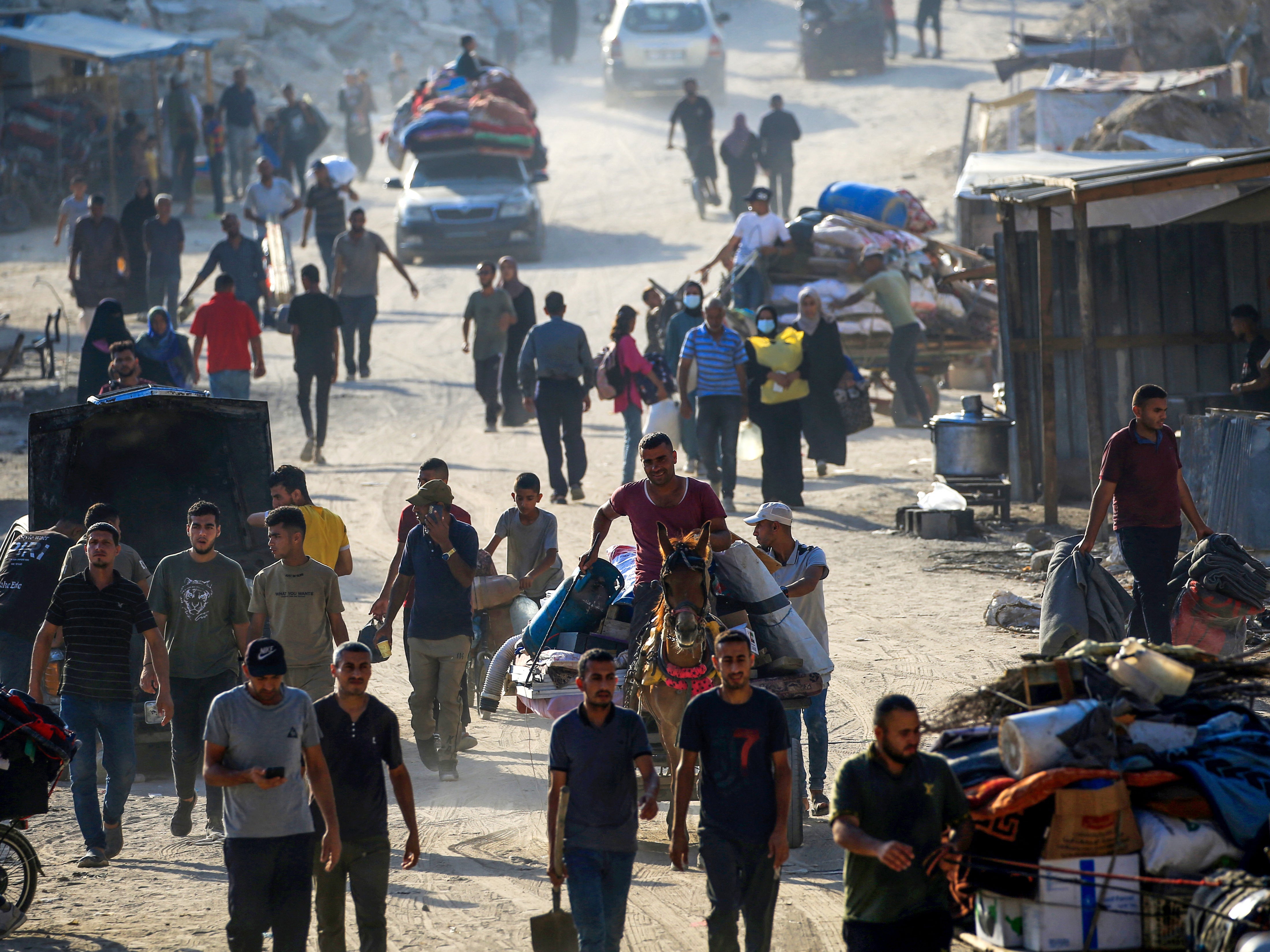 Displaced Palestinians from areas in east Khan Yunis arrive to the city as they flee after the Israeli army issued a new evacuation order for parts of the city and Rafah, in the southern Gaza Strip on 2 July 2024, amid the ongoing conflict between Israel and the Palestinian Hamas militant group