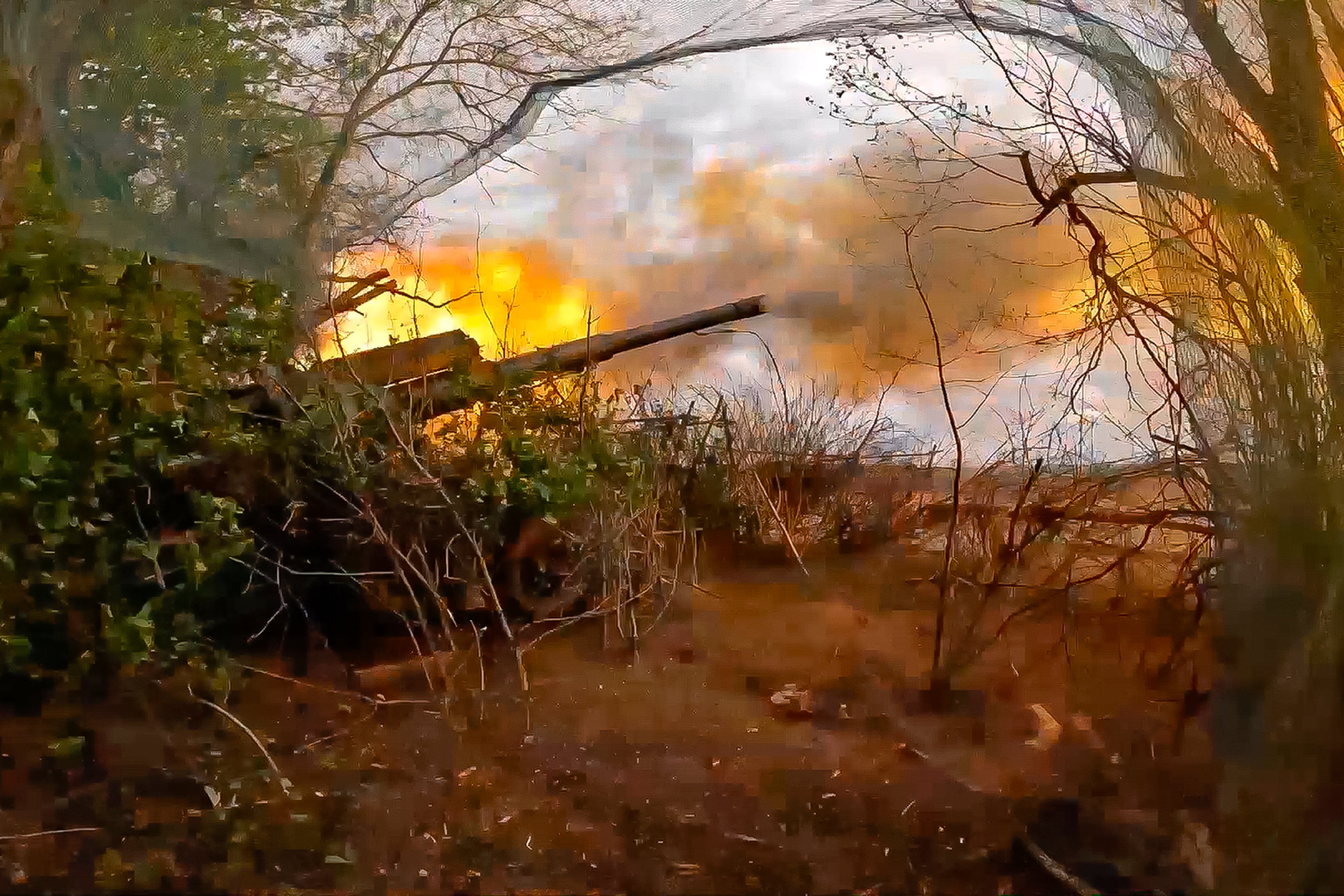 Russian soldiers fire from their 152-mm Giatsint-B howitzer from their position at Ukrainian troops at an undisclosed location in Ukraine