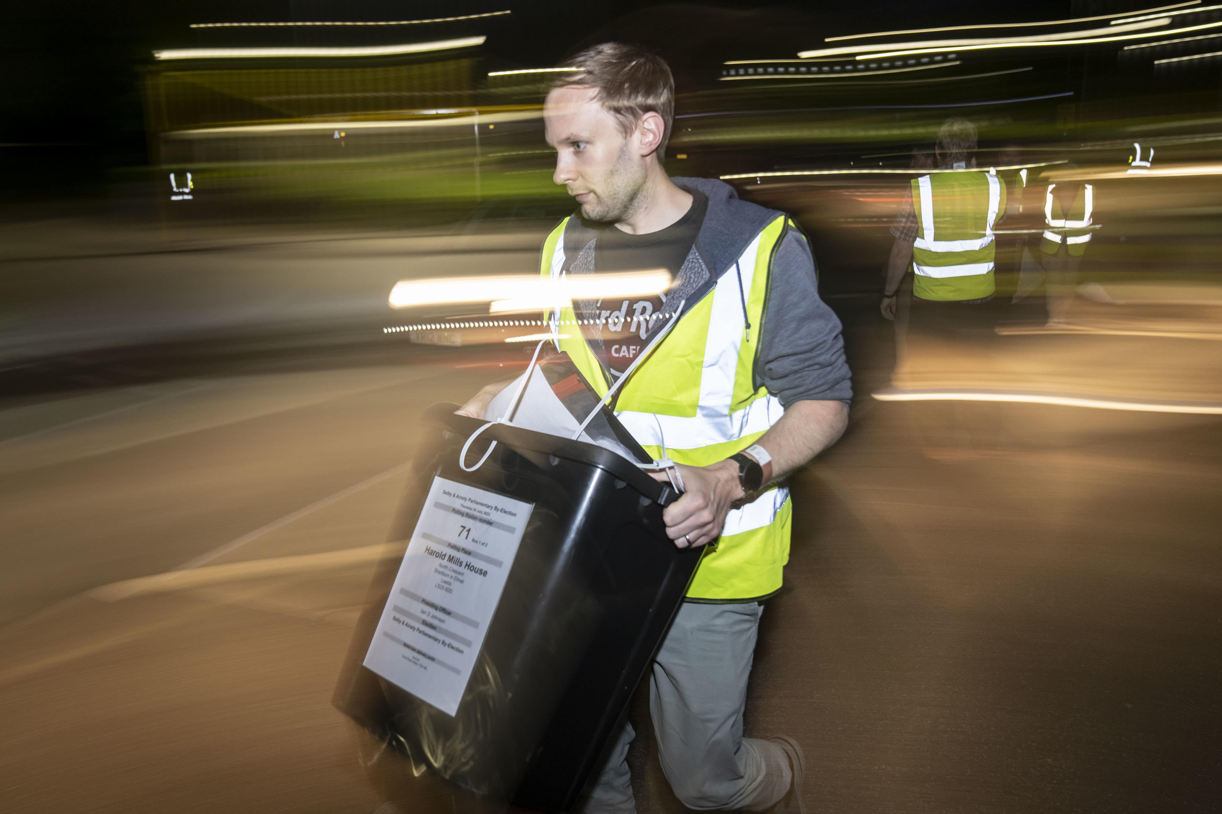 Ballot boxes arrive at an election count at an earlier election (PA)