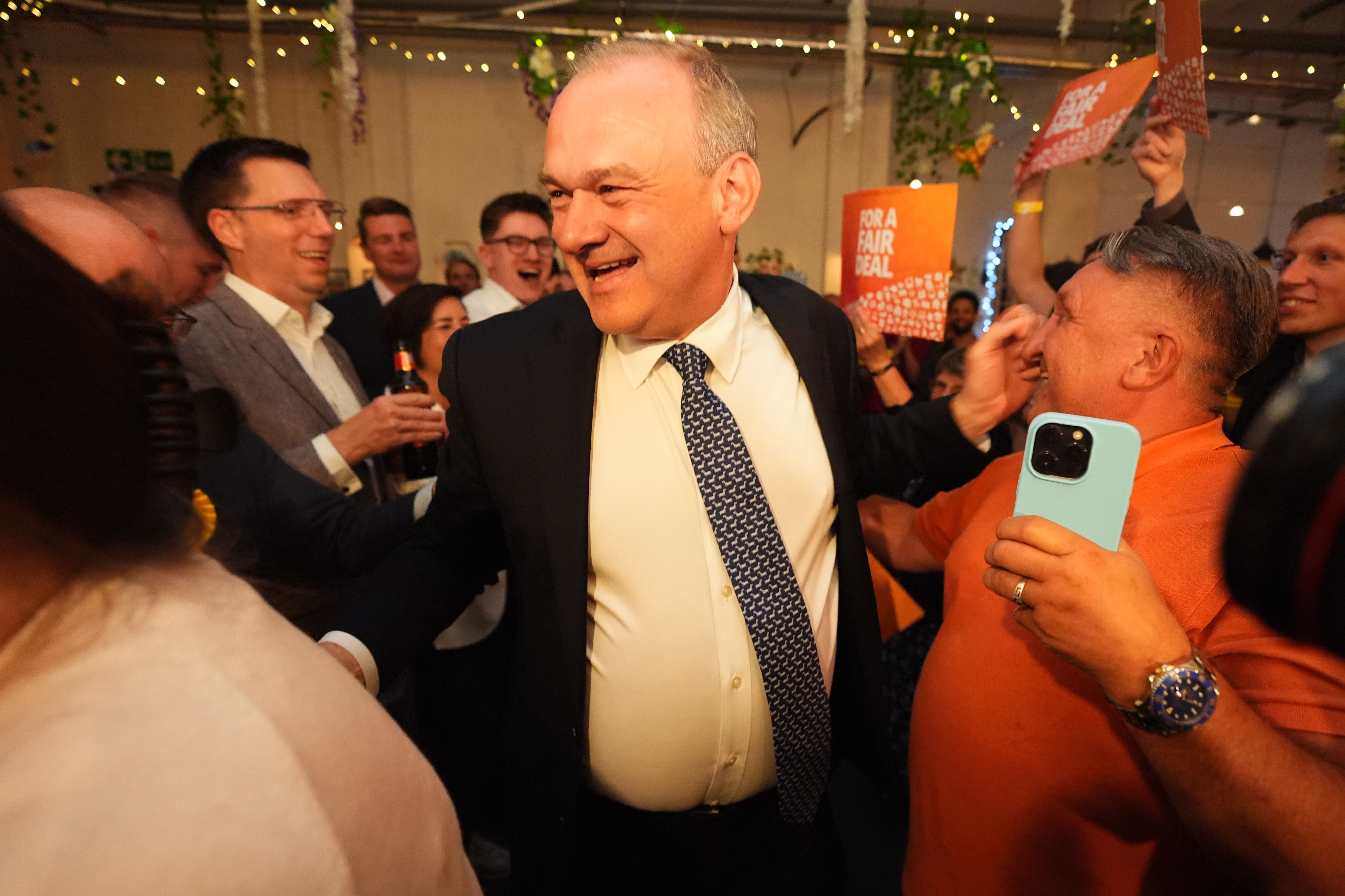 Ed Davey celebrates in London on election night