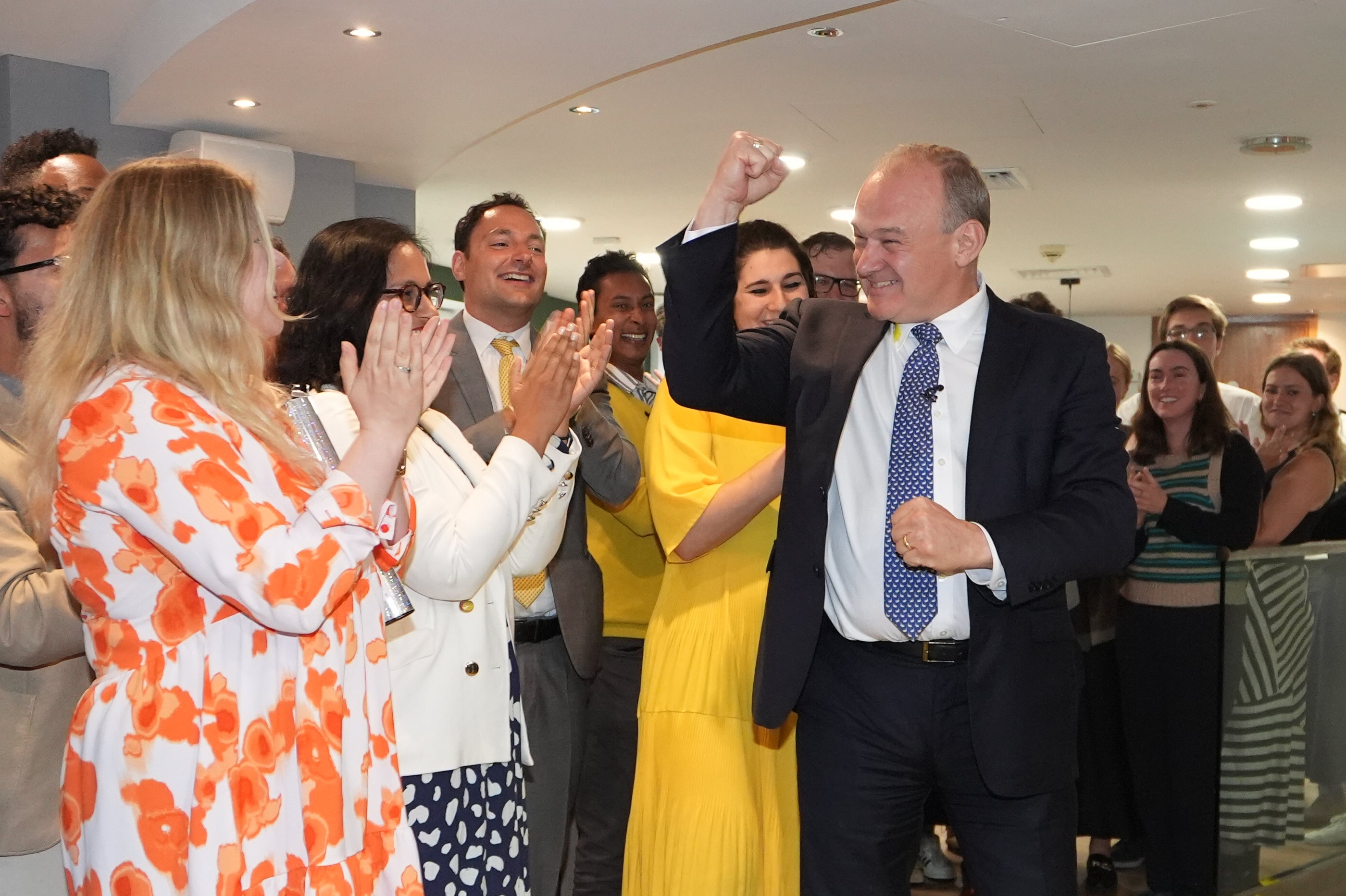 Sir Ed Davey is greeted by supporters as he returns to LibDems HQ in central London