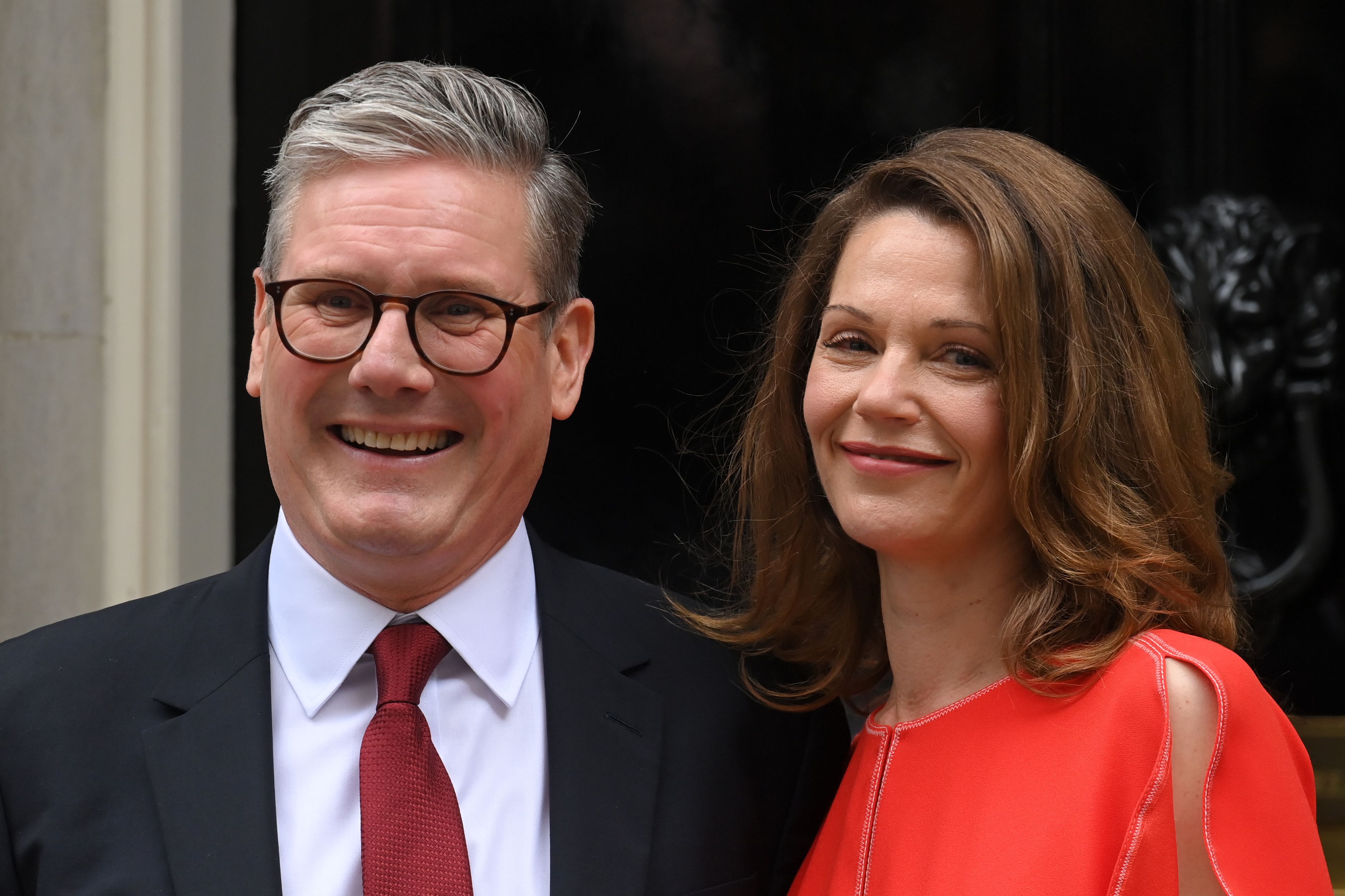 Victoria Starmer standing next to her husband at their new address 10 Downing street