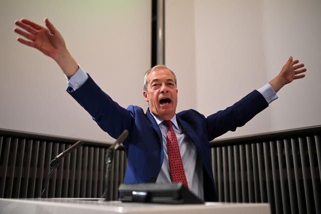 <p>Farage reacts as hecklers interrupt his speech </p>