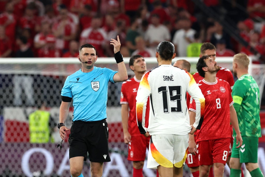 Oliver took charge of the last-16 tie between Germany and Denmark, which was briefly paused due to inclement weather