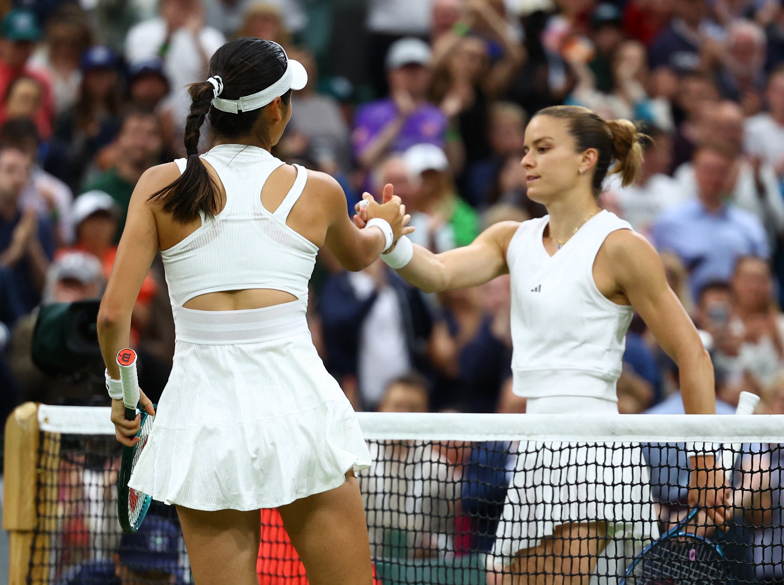 Raducanu shakes hands with Sakkari after knocking out the world No 9