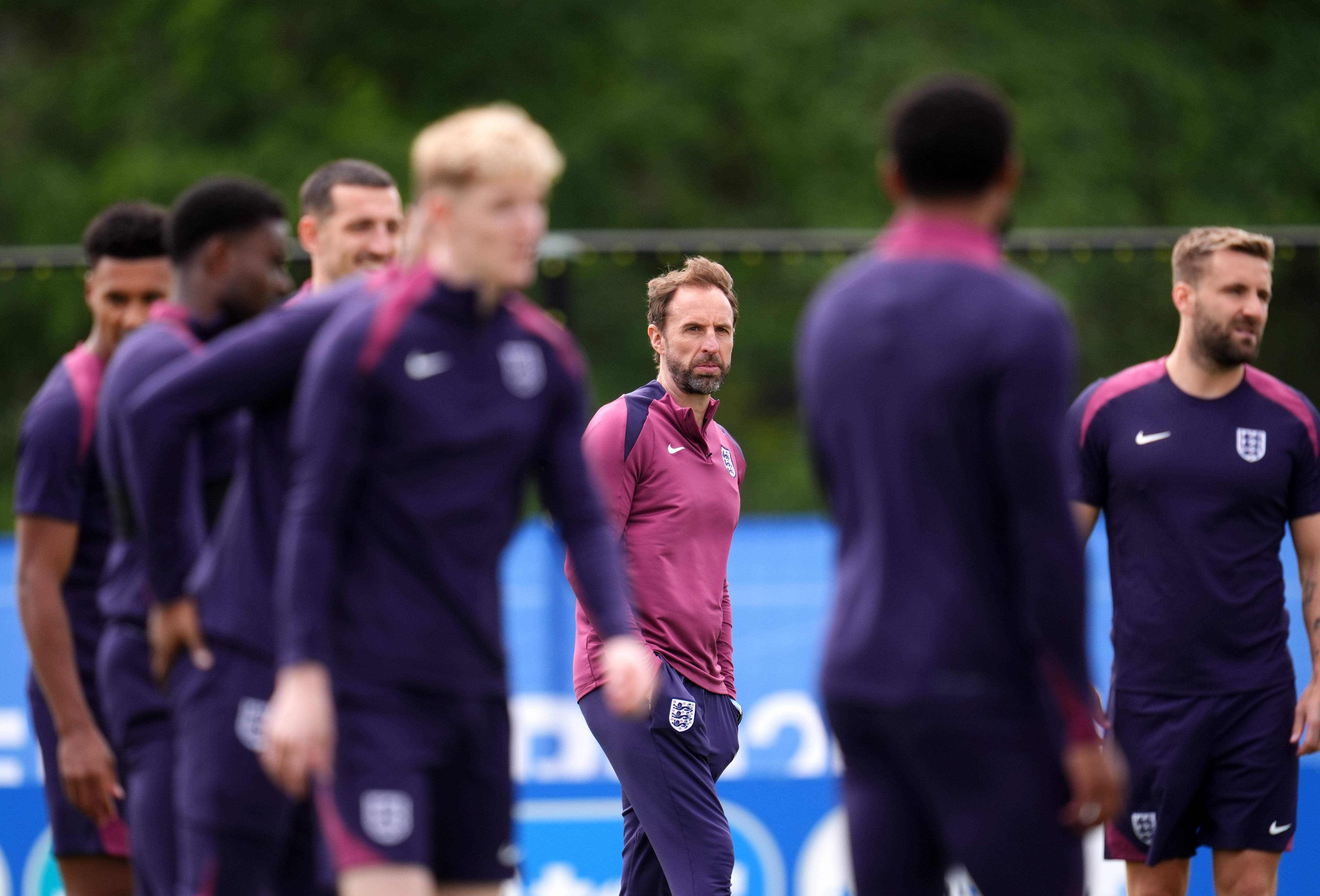 England manager Gareth Southgate stands amid players at a training session (Adam Davy/PA)